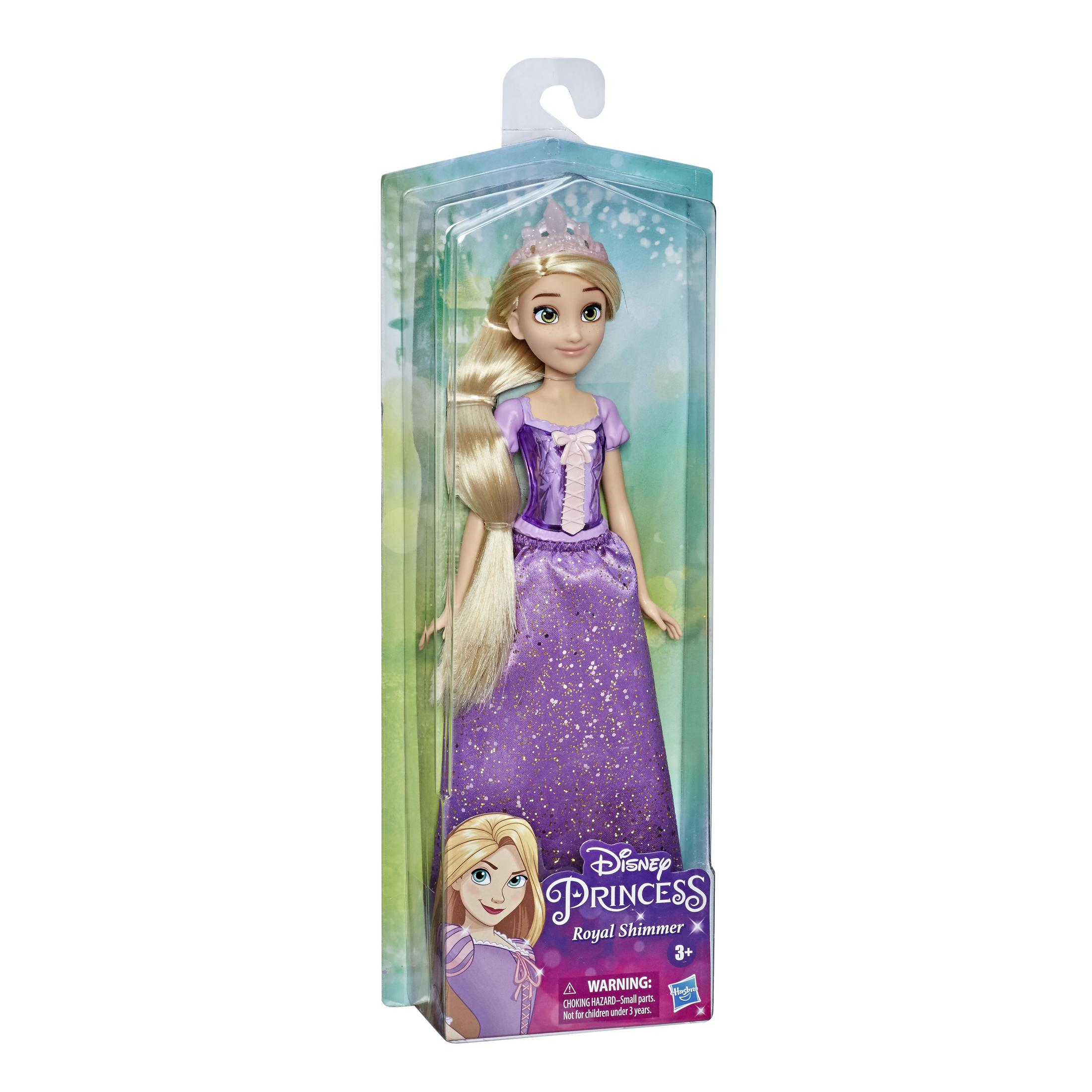 Bambola nella confezione; vestito viola, lunghi capelli biondi, tiara. Sfondo sfumato verde e bianco.