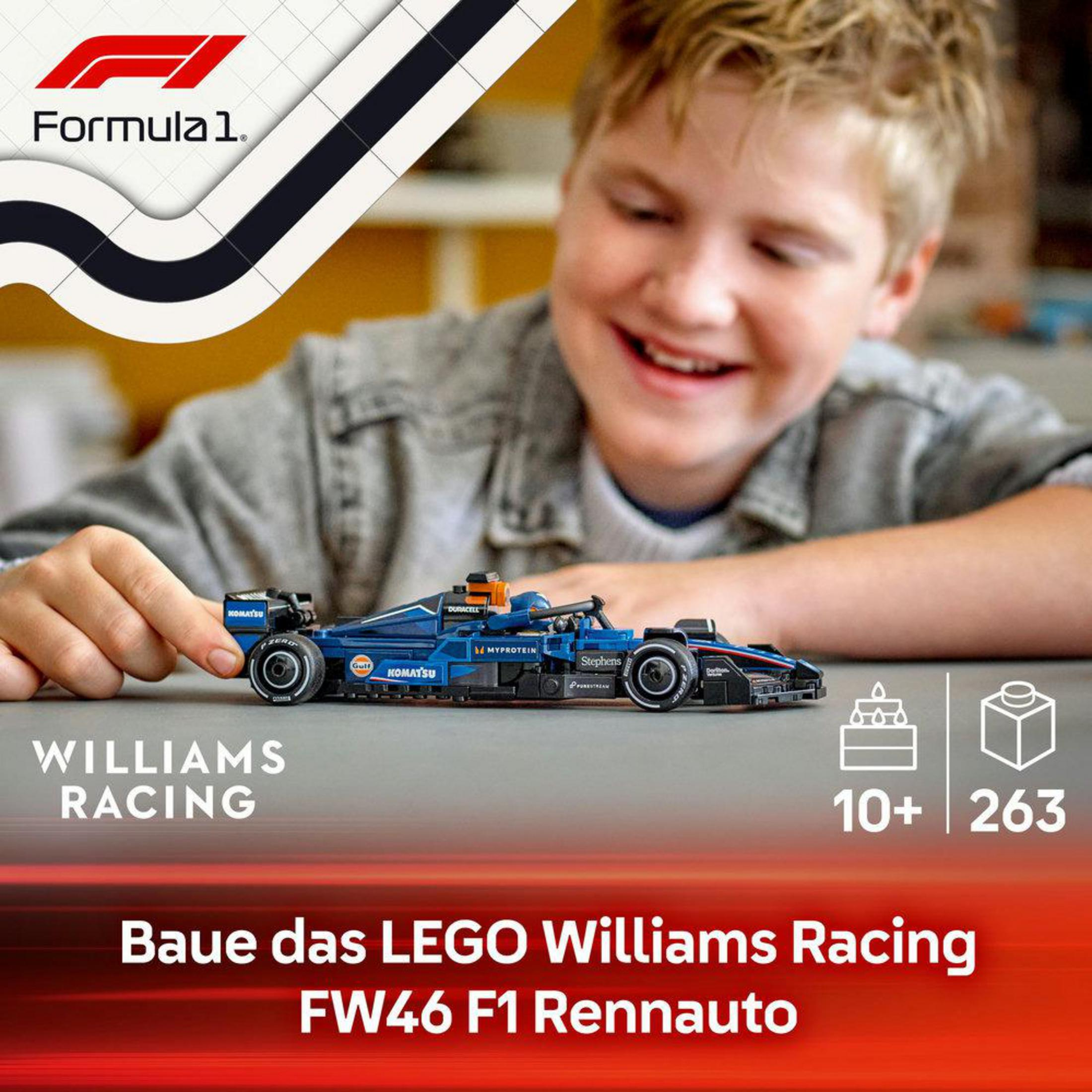 Chłopiec trzymający samochód Lego Williams Racing F1 z pudełkiem i tekstem o zestawie.