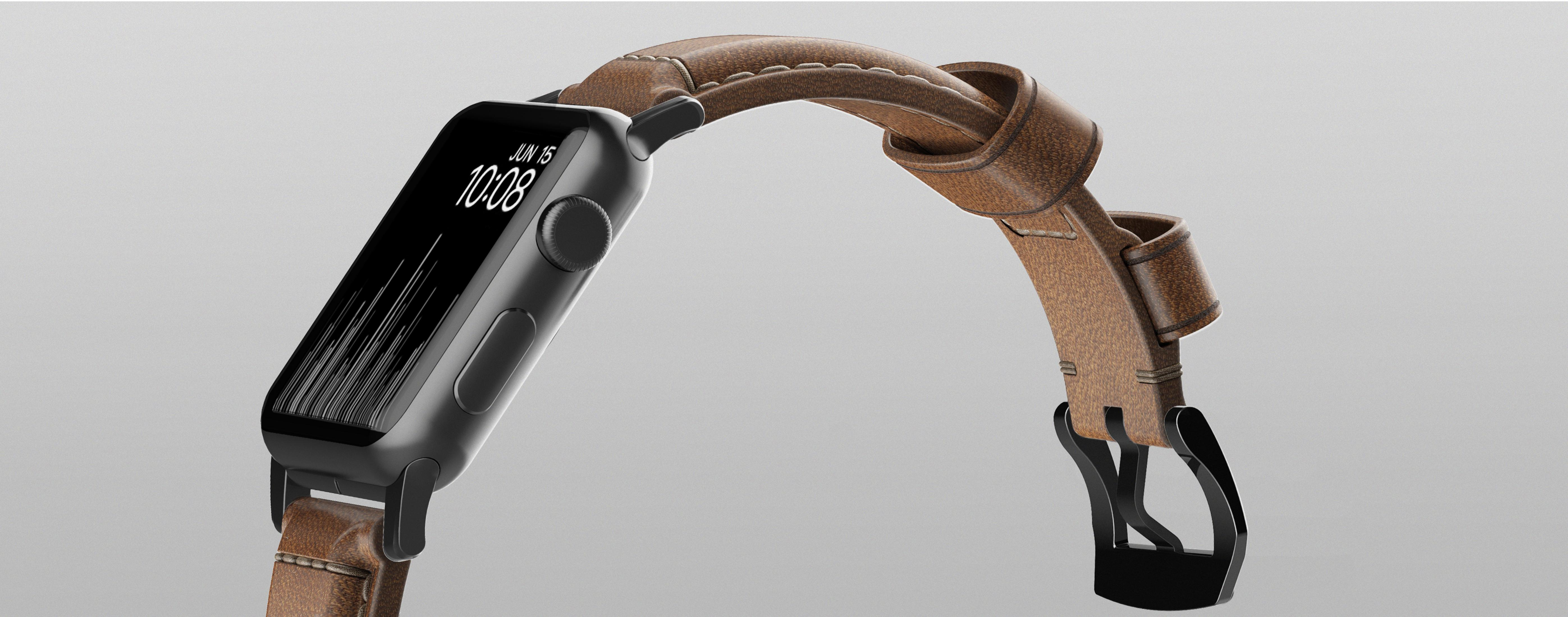 Apple Watch nera con cinturino in pelle marrone. L'orologio mostra l'ora e un'interfaccia digitale.