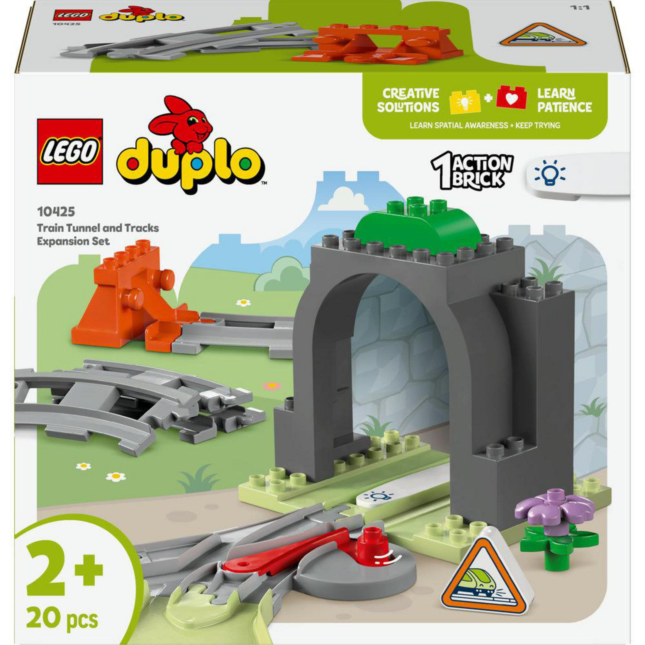 Zestaw Lego Duplo z szarym tunelem, pomarańczowymi elementami torów i pudełkiem z tekstem.