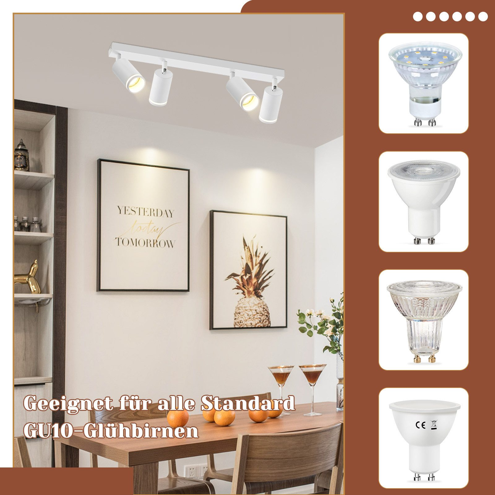 Una cucina con un lampadario e quattro luci. Ci sono lampade e quadri sul muro.