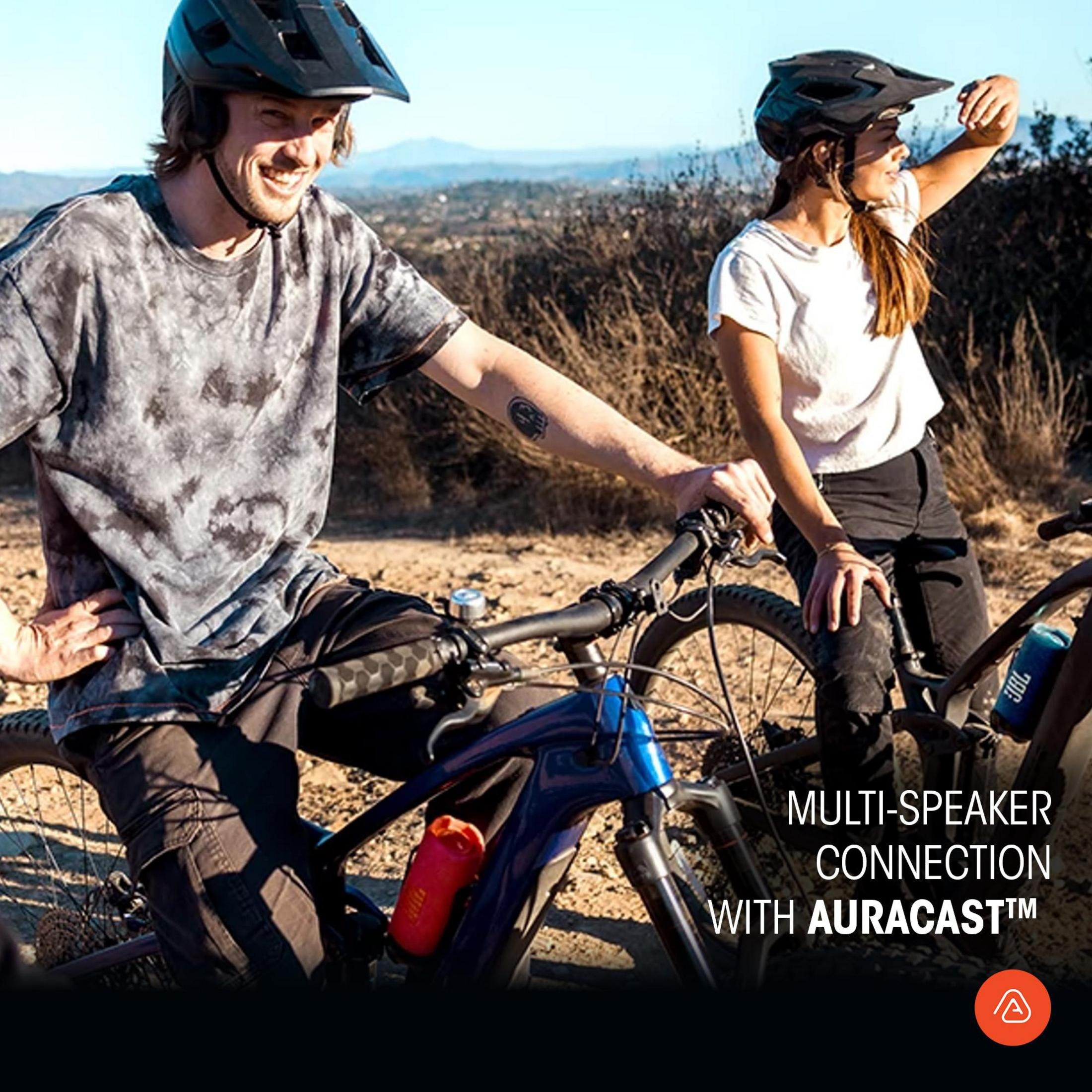 Dwie osoby na rowerach z głośnikiem JBL i nakładką tekstową.