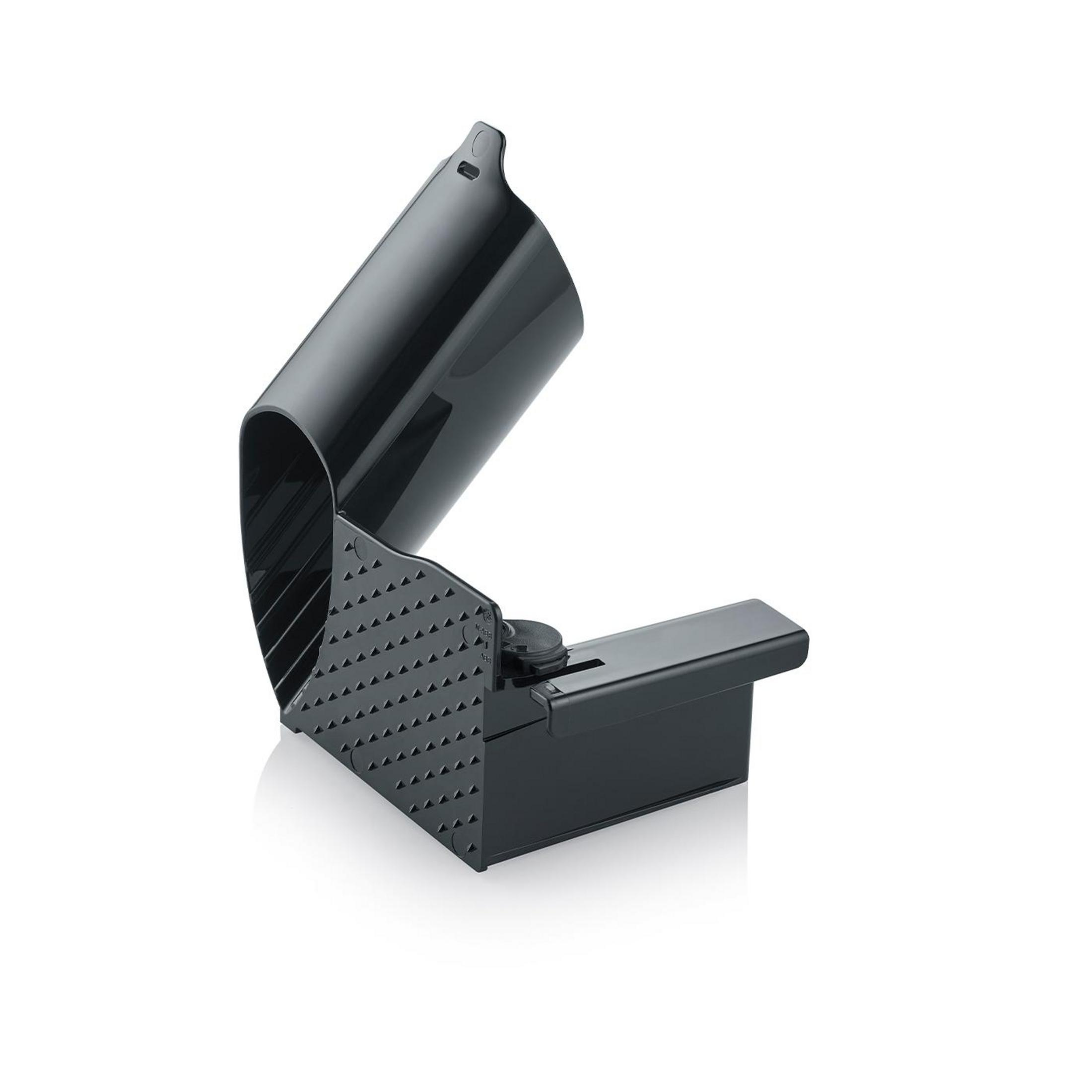 Zbliżenie czarnej pułapki na myszy w pozycji otwartej.