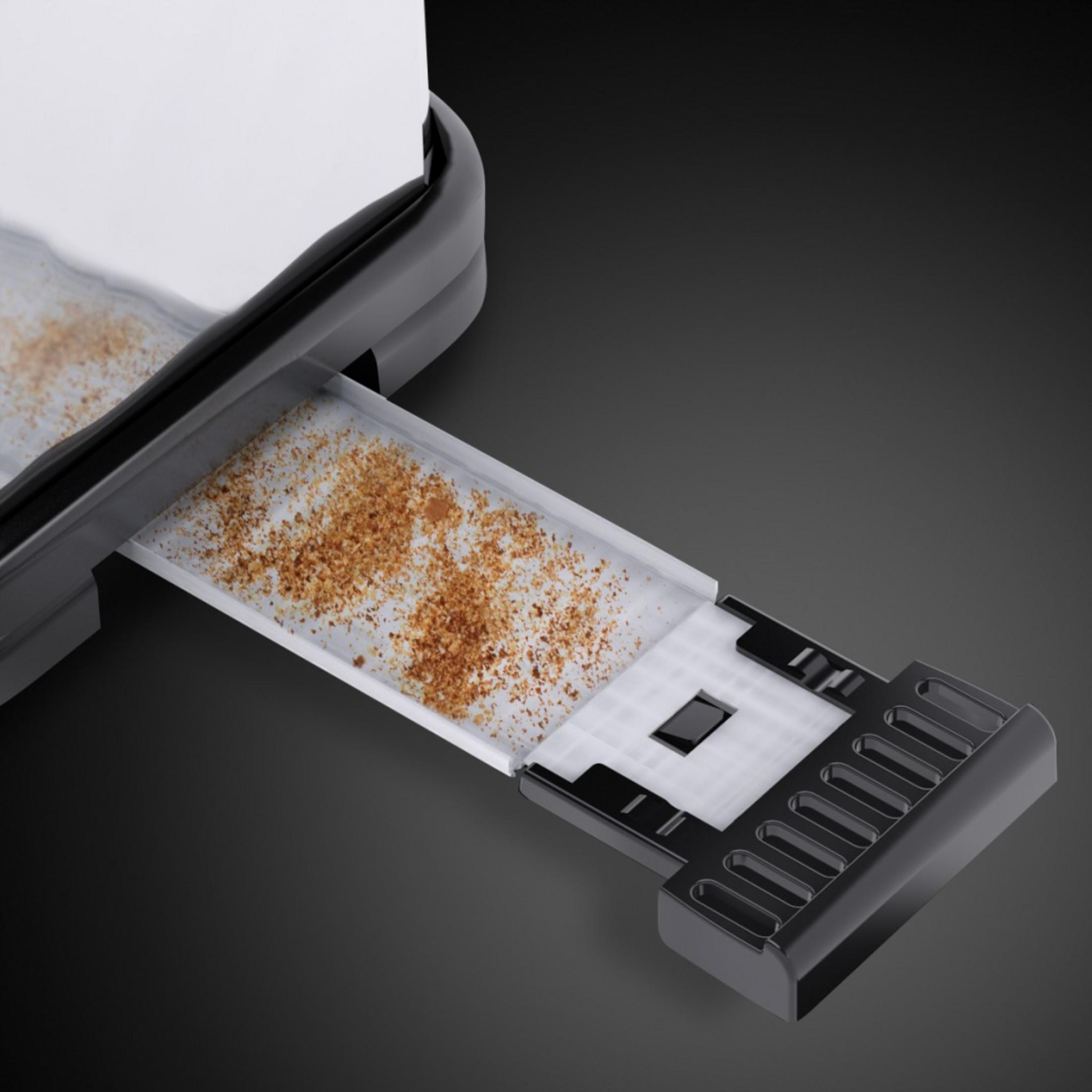 Nahaufnahme einer Krümelschublade eines Toasters, die Krümel zeigt.