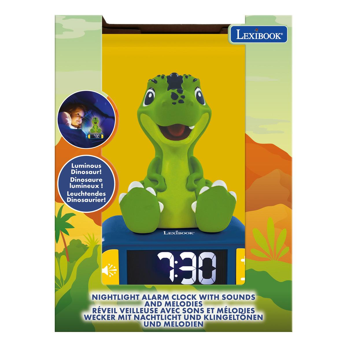 Un despertador con luz nocturna de dinosaurio verde. Tiene una base azul y muestra la hora 7:30.