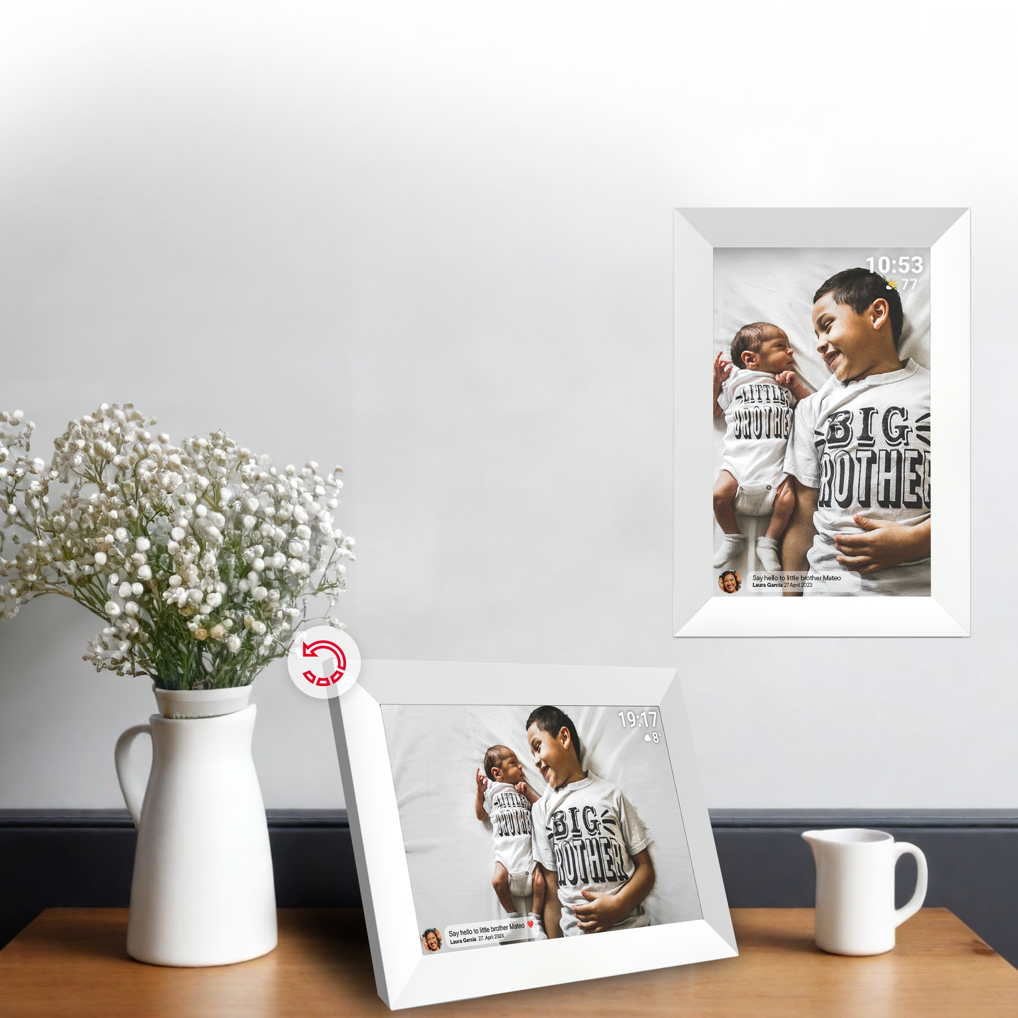 Two white framed photos with babies and a boy on a table with a vase of flowers.