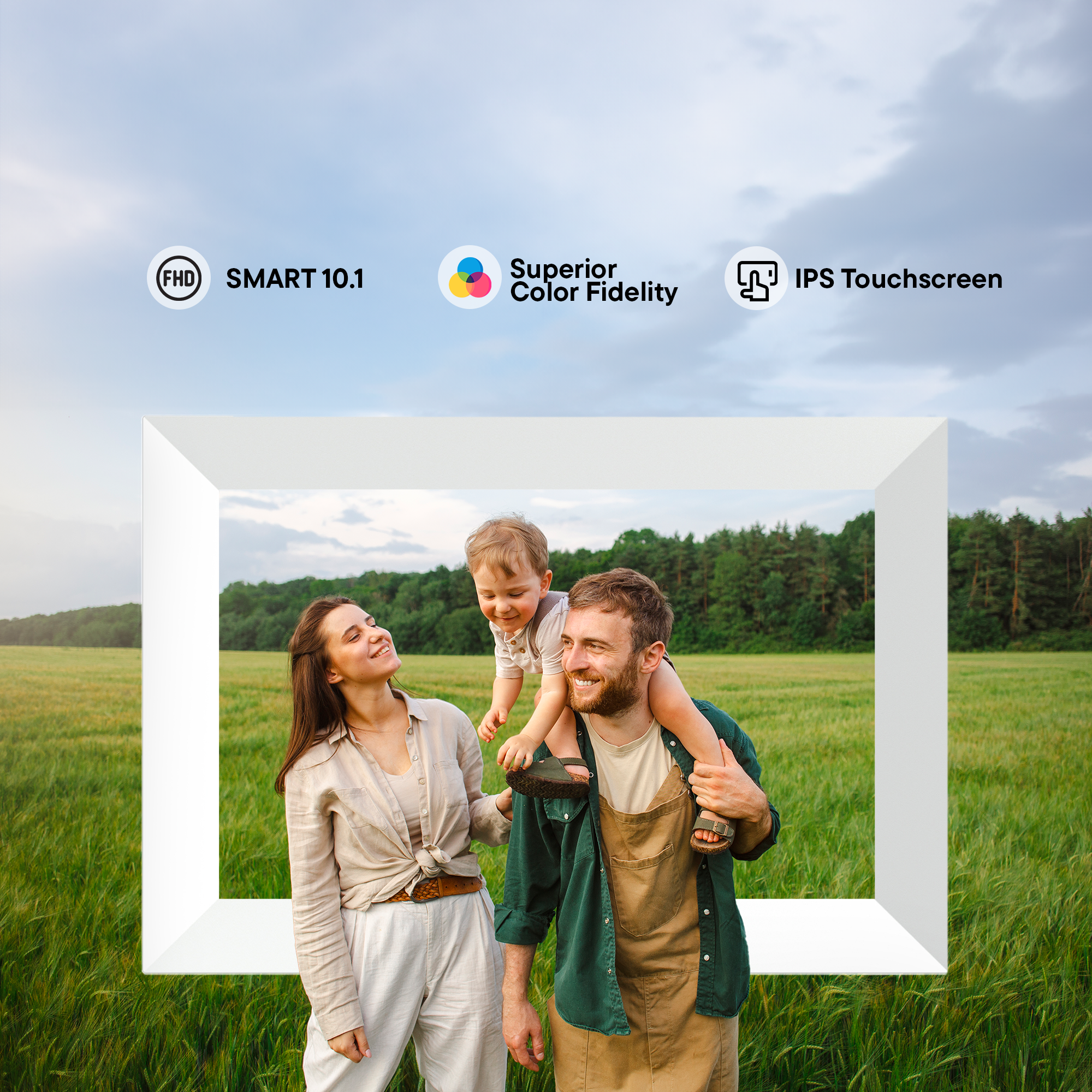 A family stands together in front of a large frame in a field.