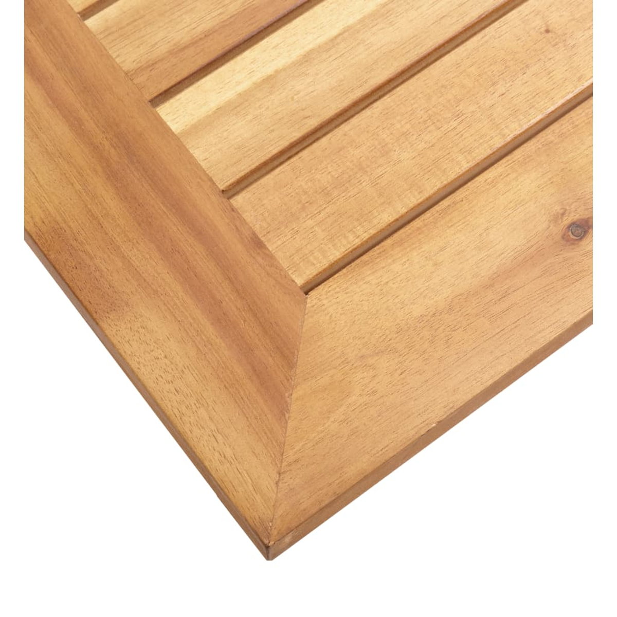 Nahaufnahme einer Holztischecke. Das Holz ist hellbraun.