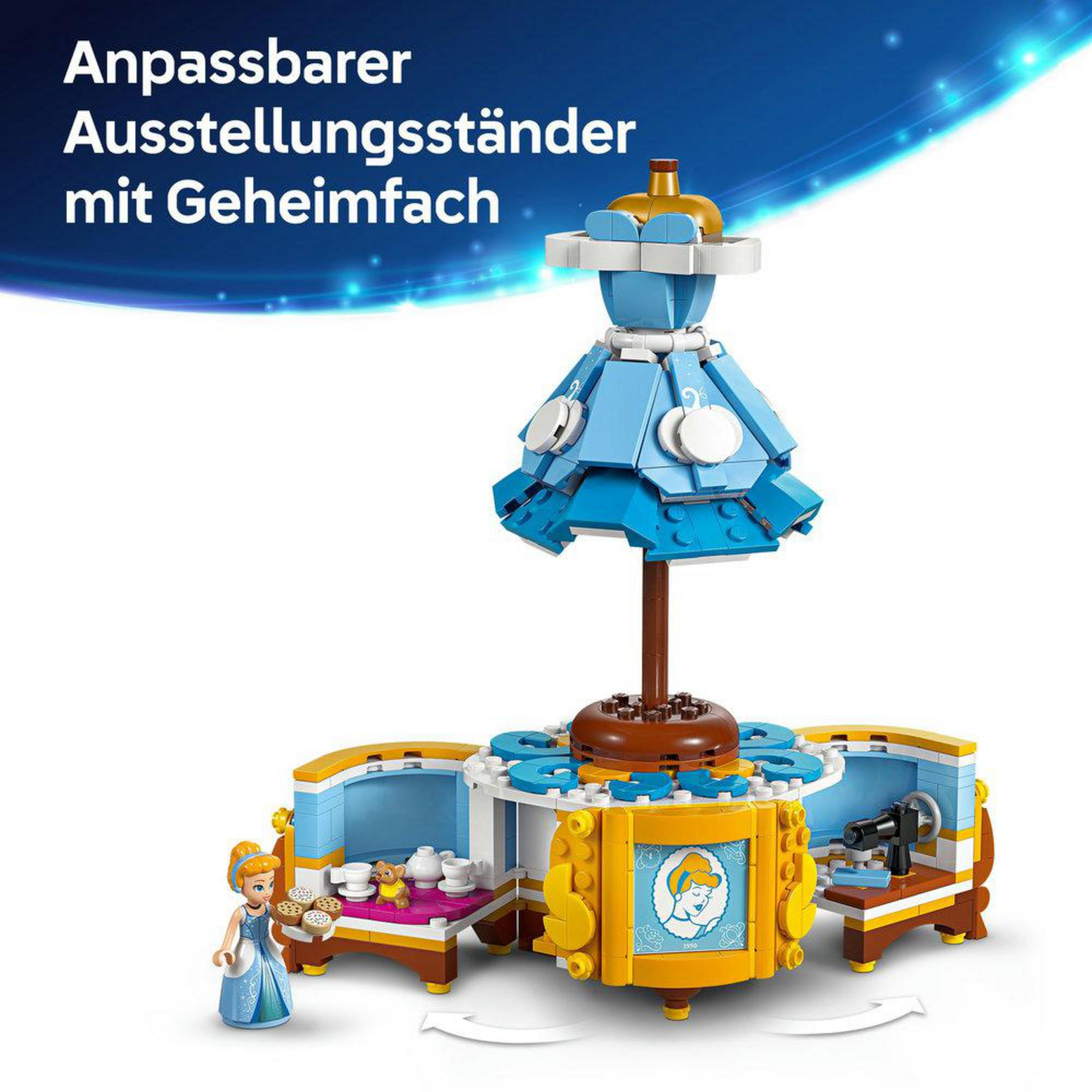 Zestaw wystawowy LEGO z suknią Kopciuszka i minifigurką. Dominują kolory niebieski, żółty i biały.