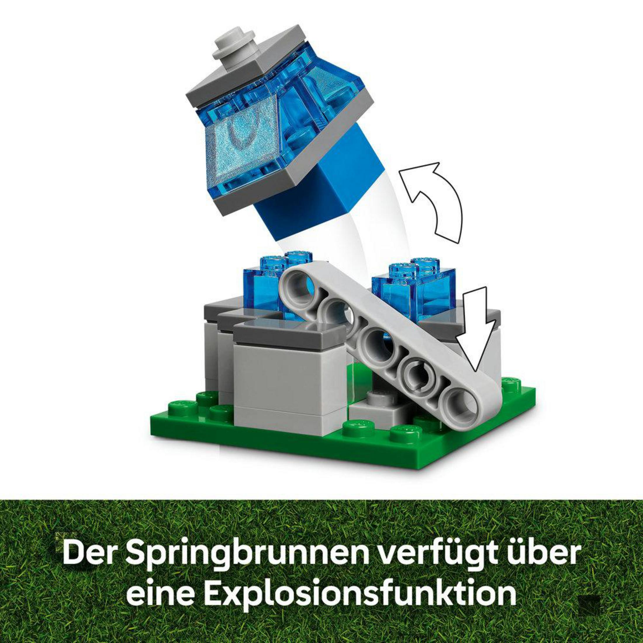 Zestaw LEGO Minecraft z fontanną i funkcją eksplozji, zbudowany na zielonej płytce bazowej.