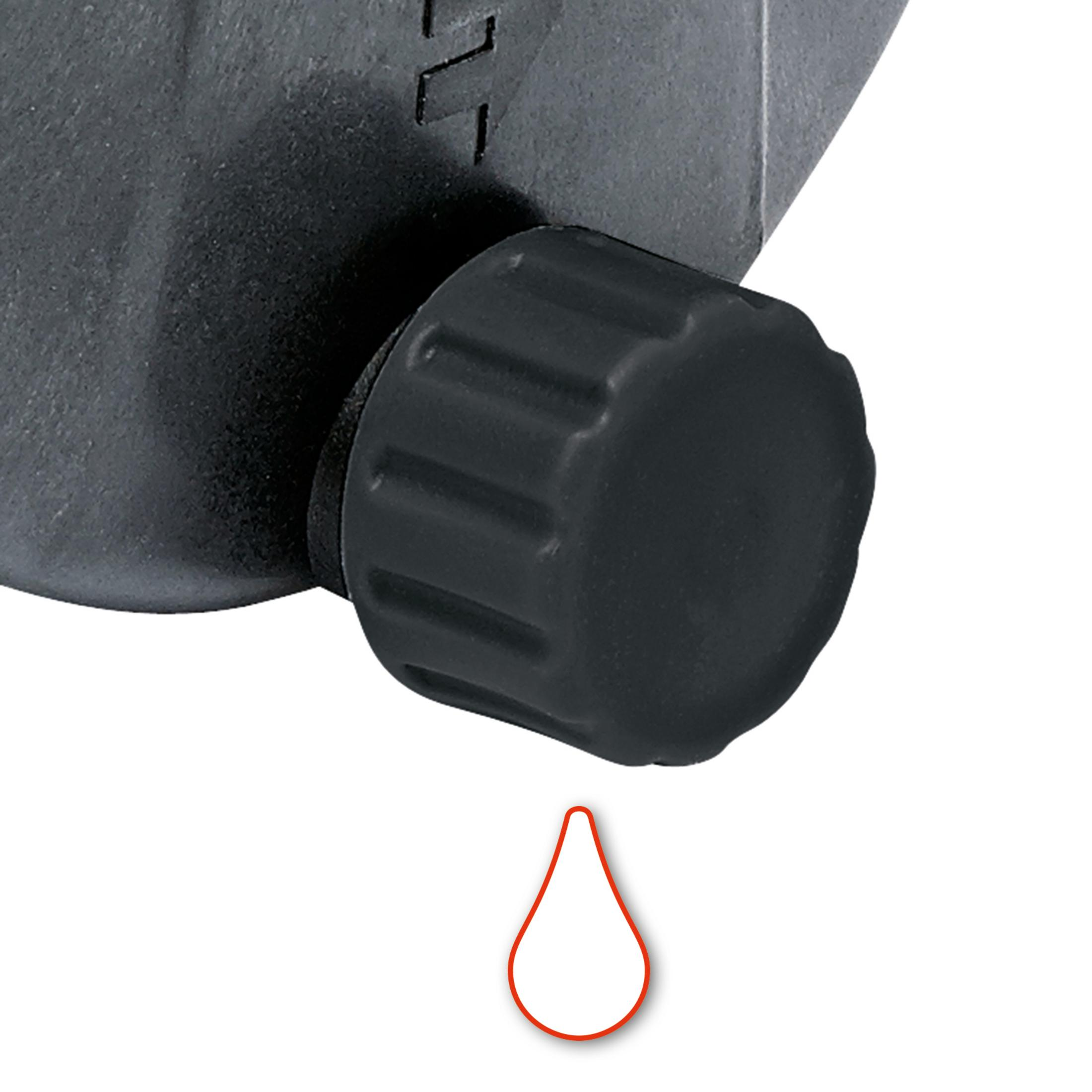 Nahaufnahme eines schwarzen Knopfes an einer schwarzen Maschine mit rotem Tropfensymbol.