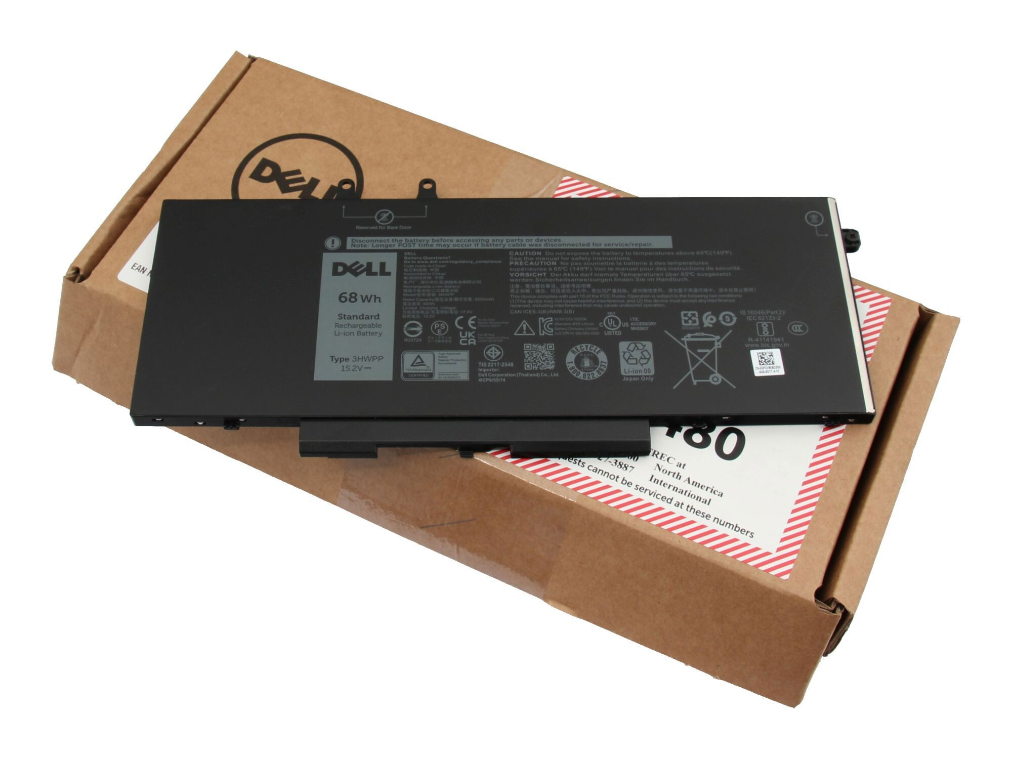 Ein Dell-Laptop-Akku in einem Karton. Der Akku ist schwarz mit weißen Etiketten.