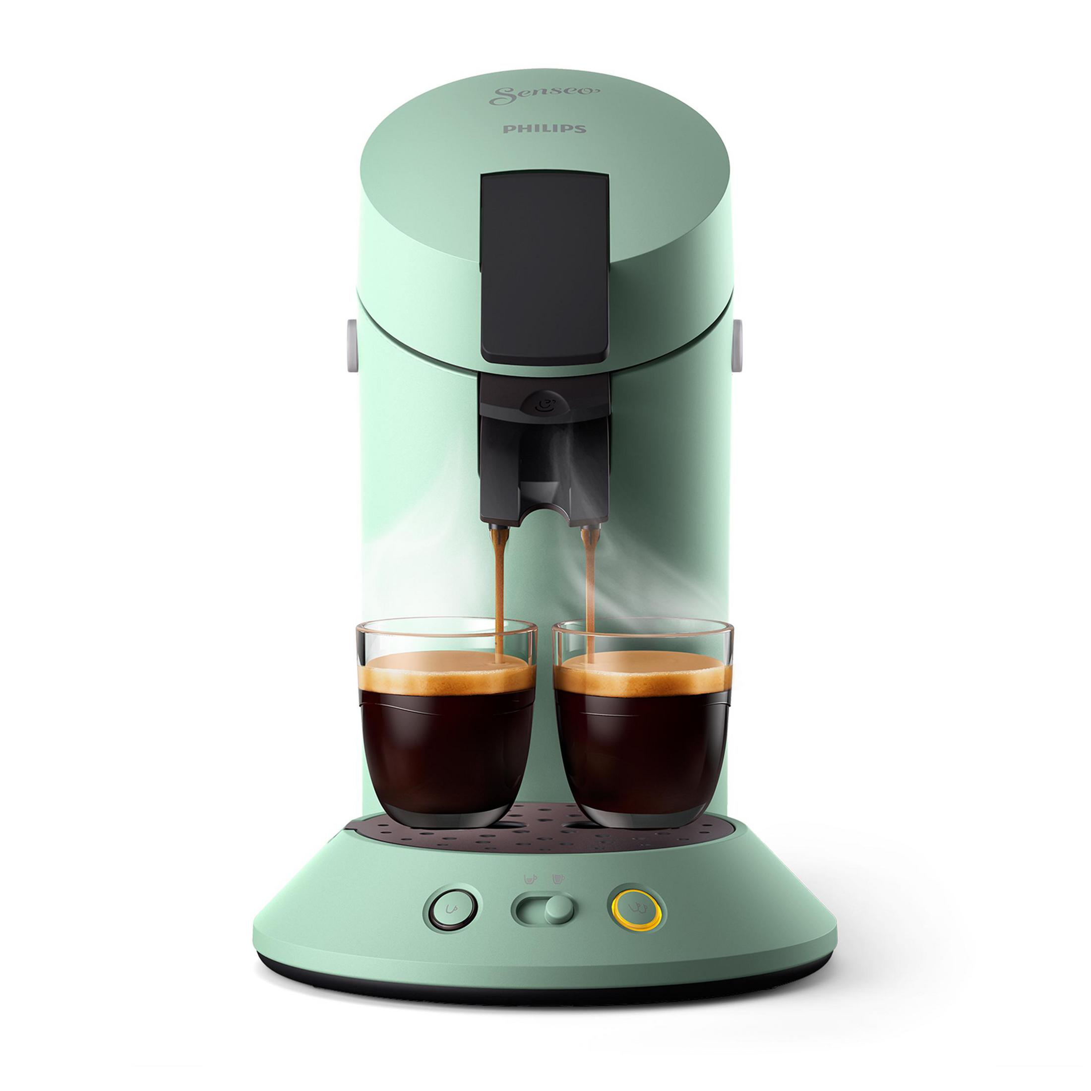 Grüne und schwarze Kaffeemaschine, die zwei Tassen Kaffee zubereitet. Zwei Gläser Kaffee sind sichtbar.