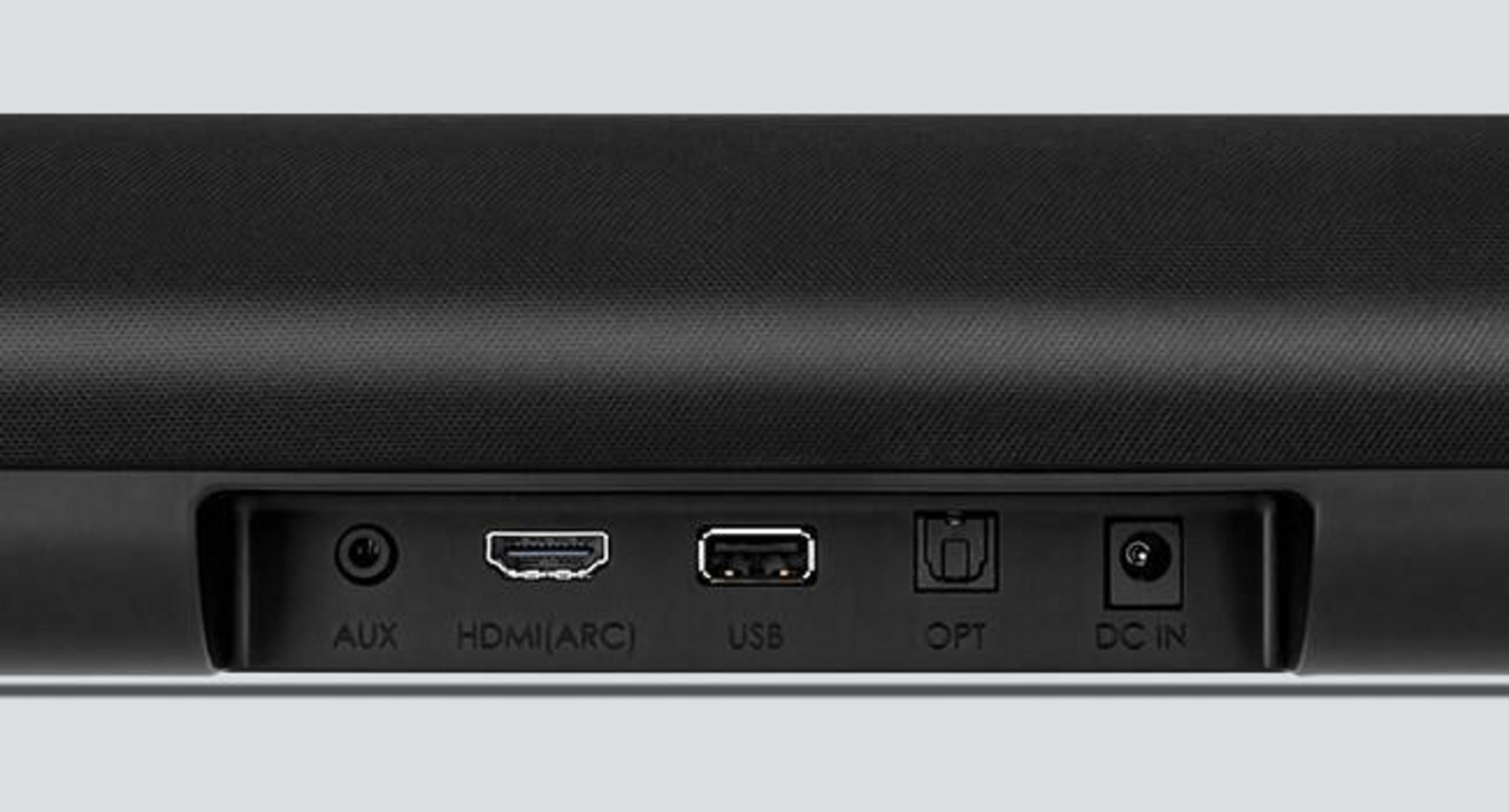 Czarny soundbar z różnymi portami. Białe tło.