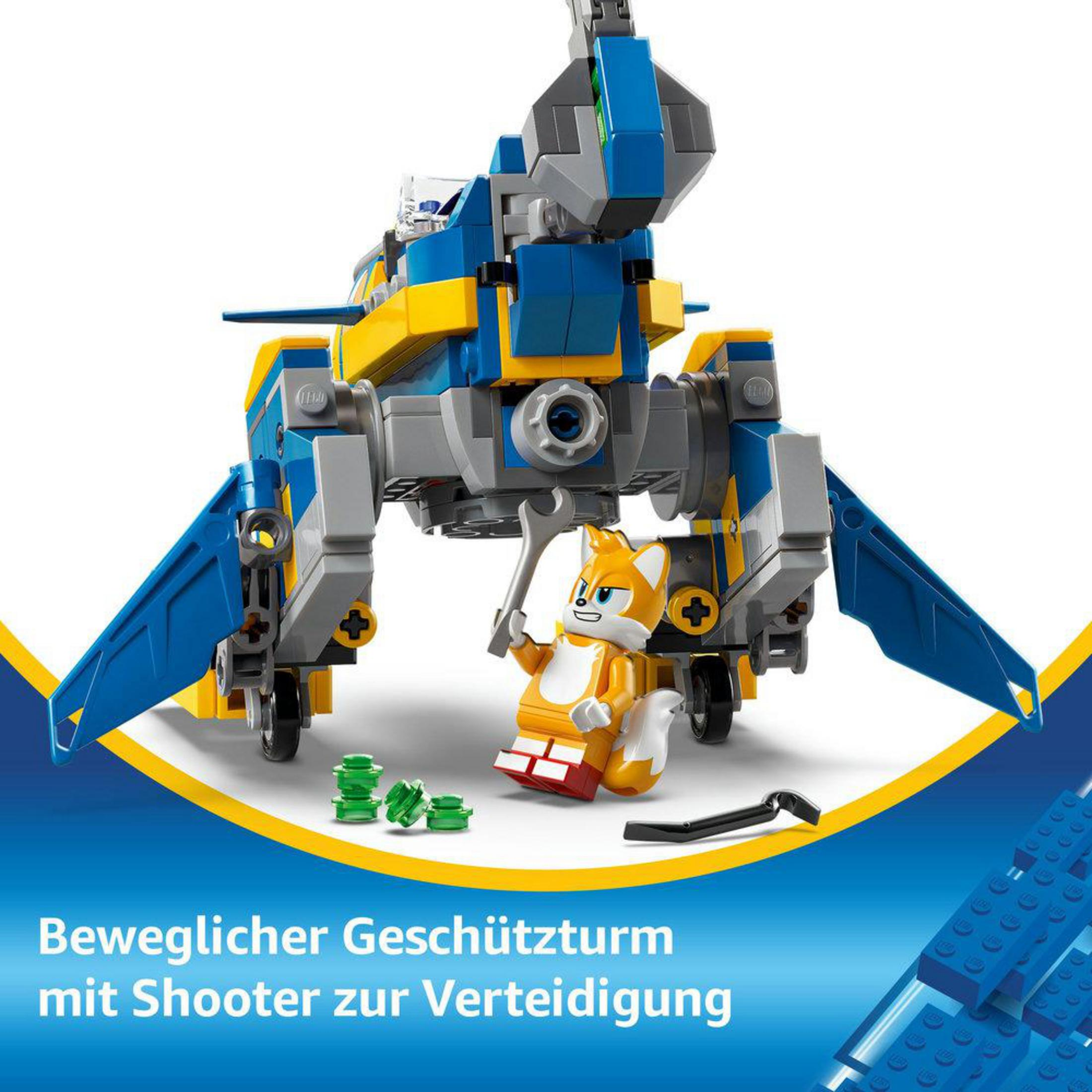 Robot Lego z figurką Tails na białym tle. Wygląda na to, że się bawi.