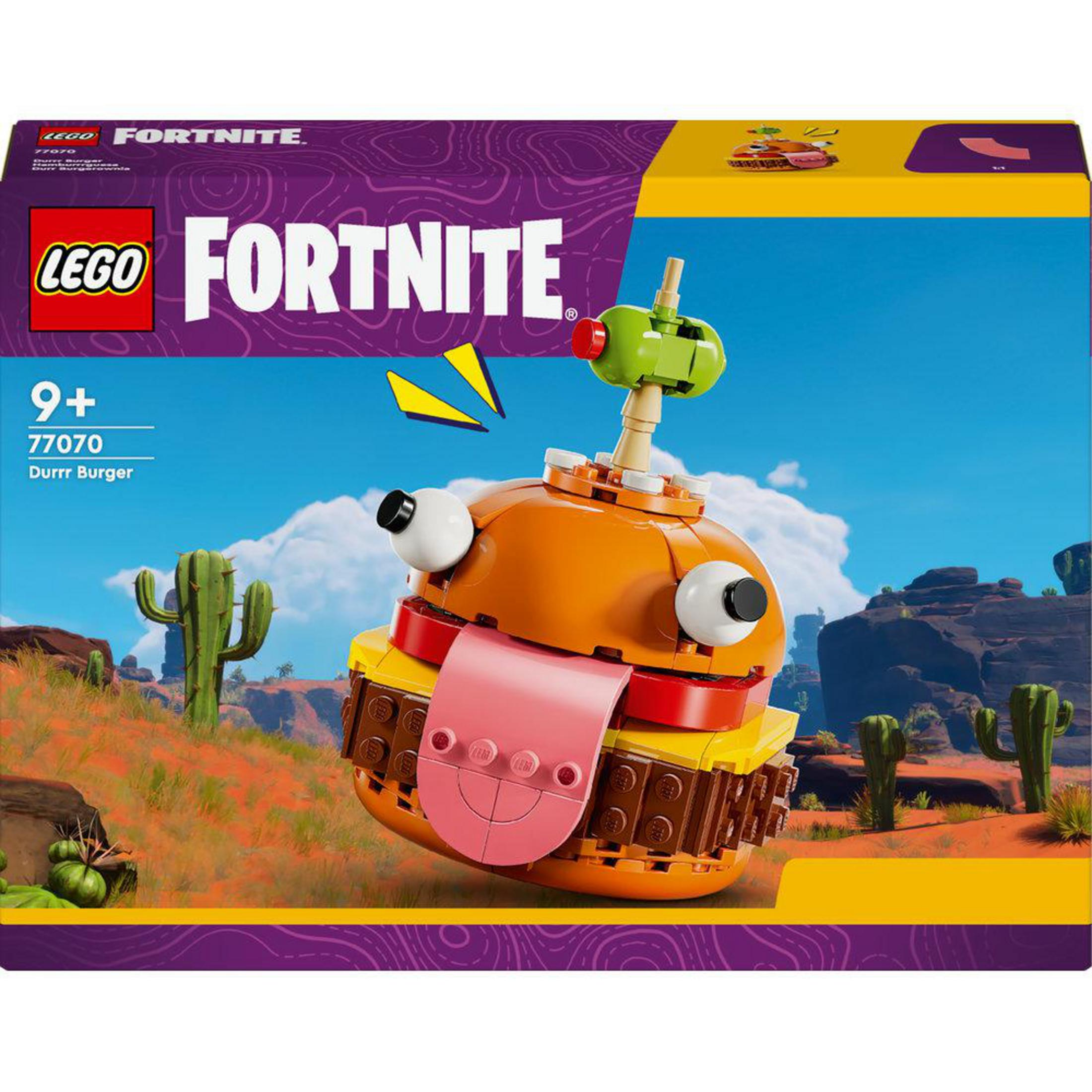 Ein Lego Fortnite Durrr Burger Set. Der Burger ist orange, mit einer rosa Zunge. Die Box ist im Hintergrund sichtbar.