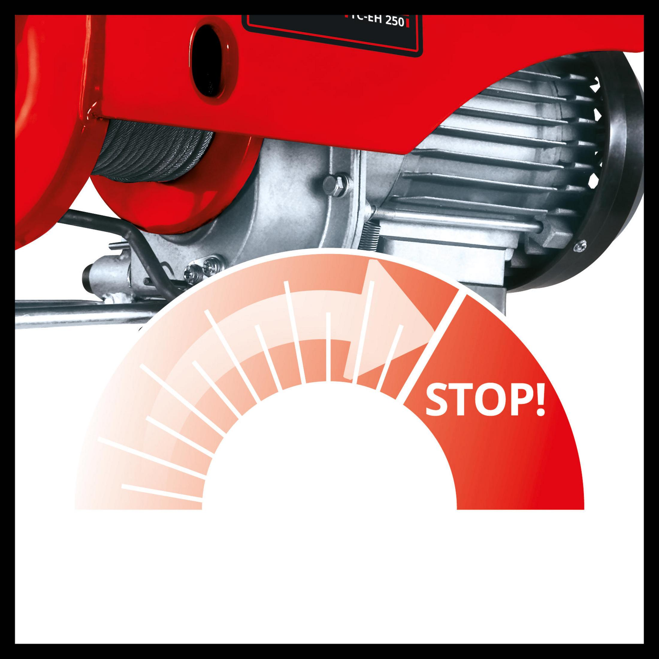 Roter Elektro-Hebezug mit Stoppanzeige. Das Schild zeigt das Wort 'STOP' in Weiß.