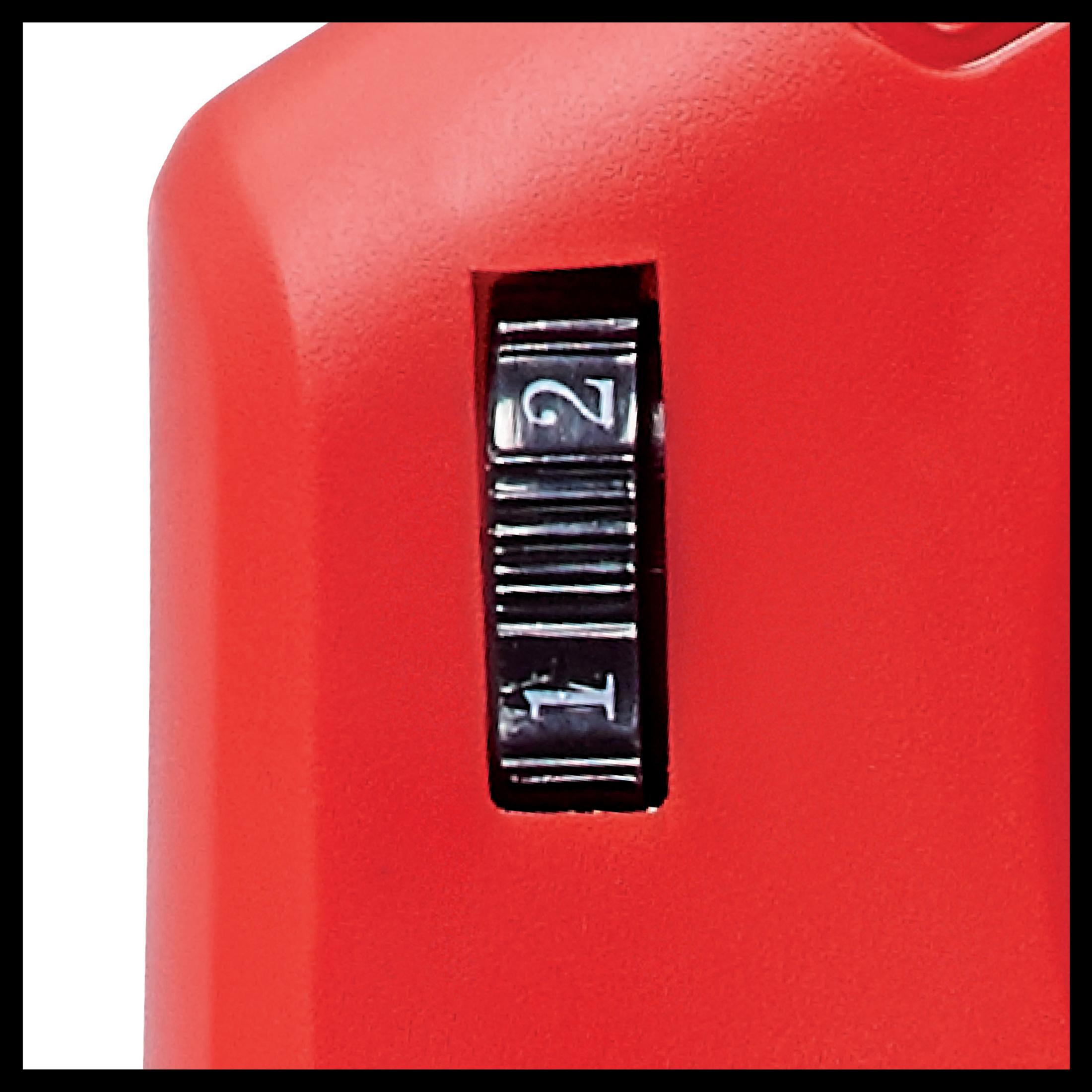 Czerwone plastikowe narzędzie z pokrętłem numerycznym pokazującym cyfrę 2.