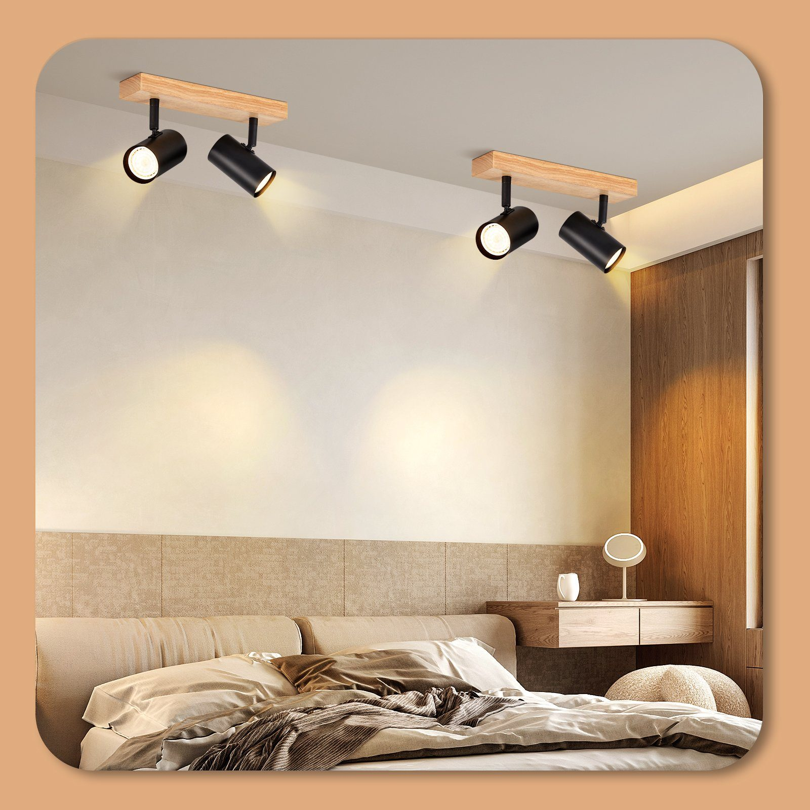 Due faretti neri montati su travi di legno, su un soffitto beige. La stanza ha un letto e una cassettiera.