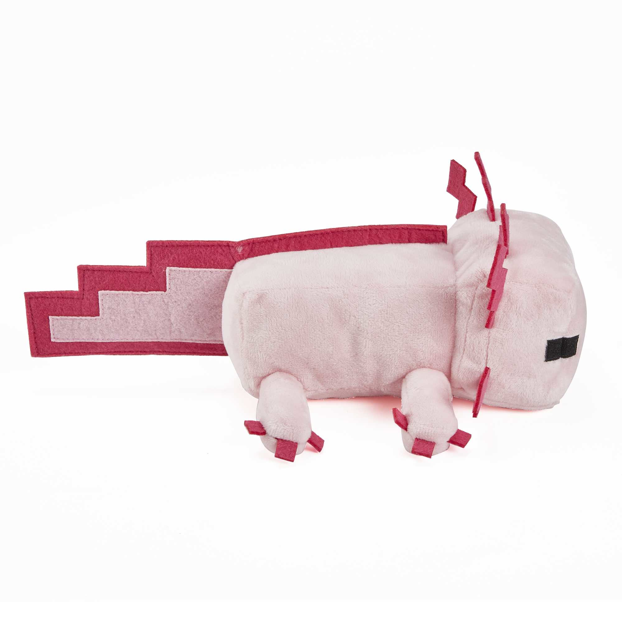 Peluche axolotl rosa di Minecraft con dettagli rossi. Sfondo bianco, coda visibile.
