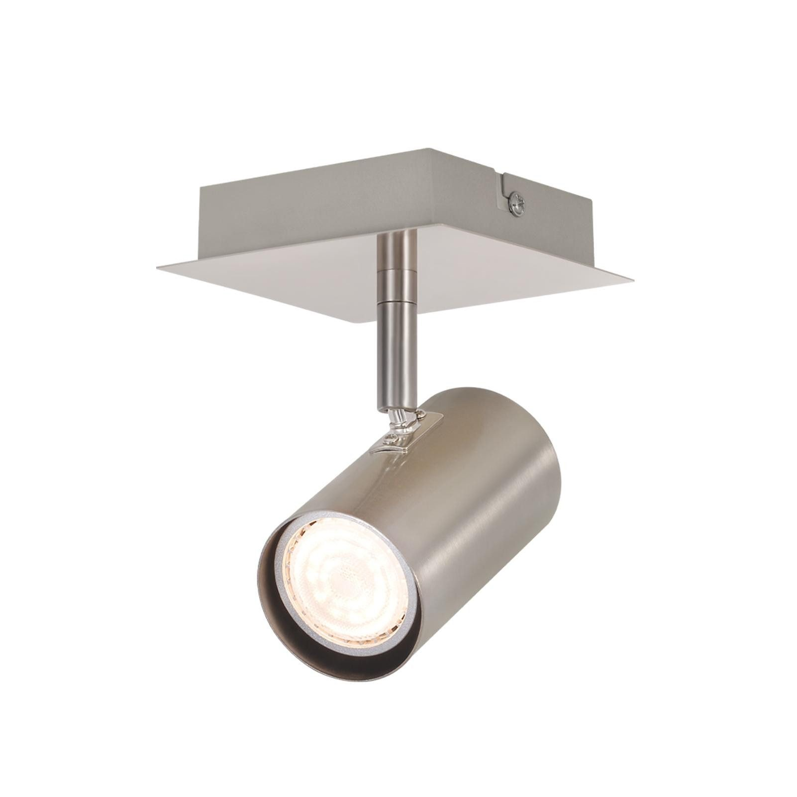 Un faretto cilindrico argentato montato su una placca da soffitto quadrata.