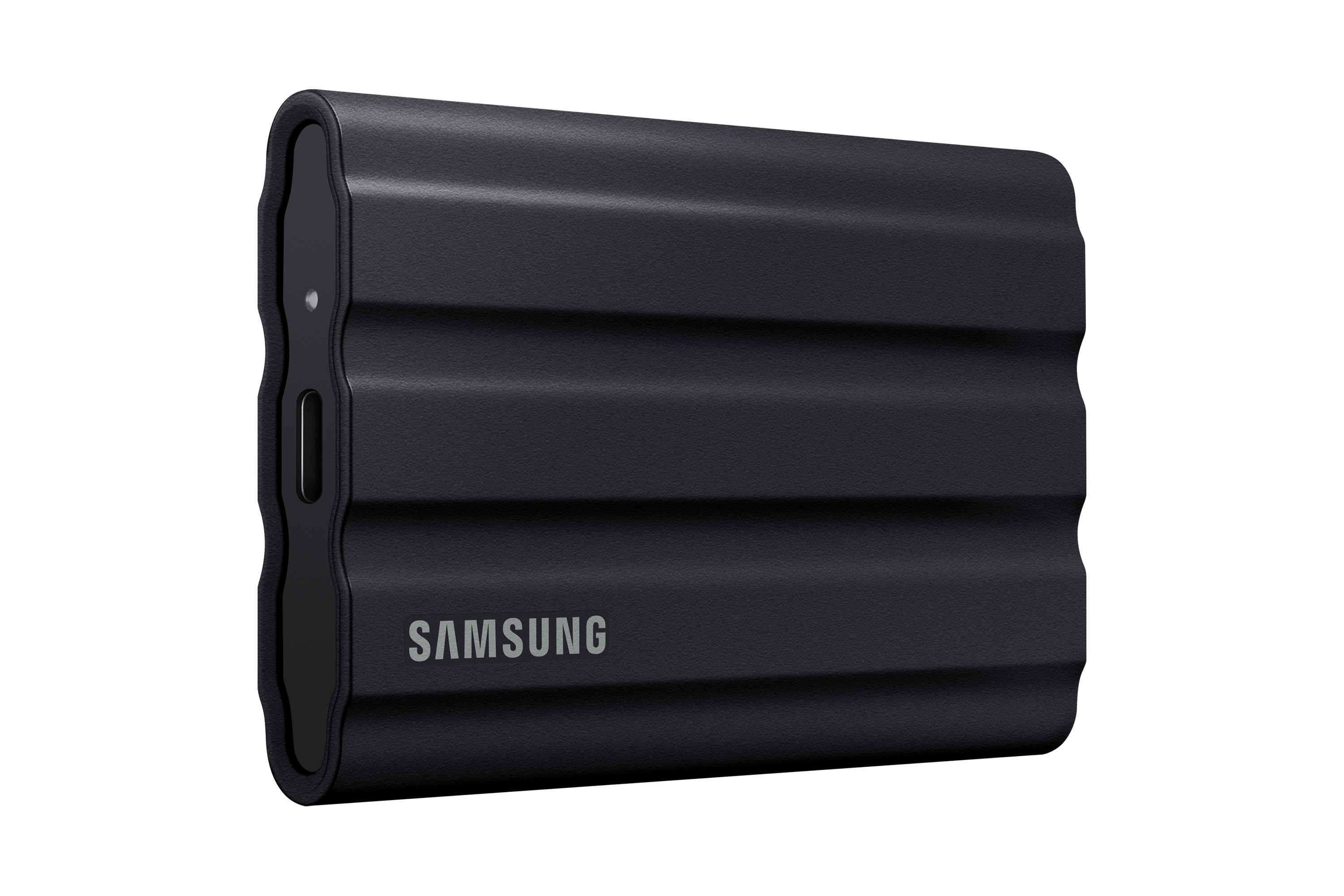 Black Samsung external SSD with ridges. SAMSUNG is written on the front.