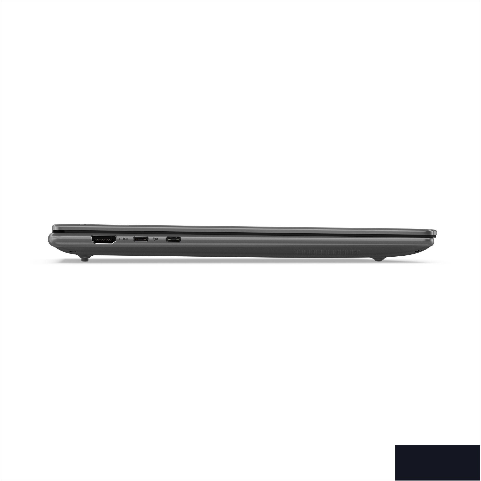 Side view of a closed, dark gray laptop on white background. Ports visible on the side.