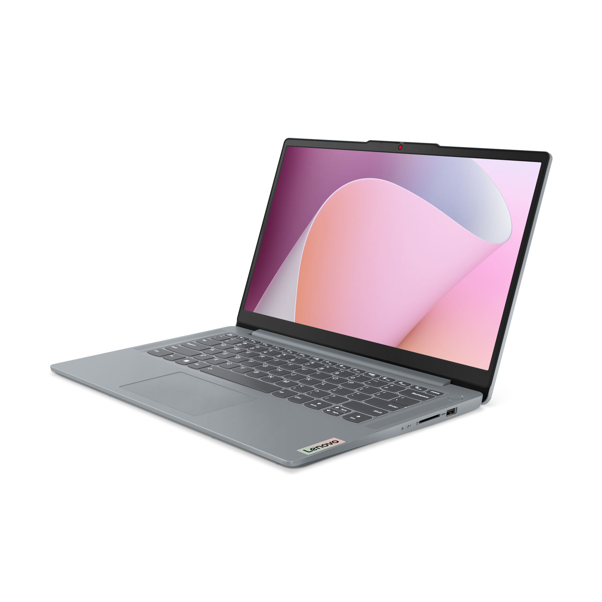 Ordenador portátil gris, abierto, sobre superficie blanca. La pantalla muestra un diseño rosa y blanco.