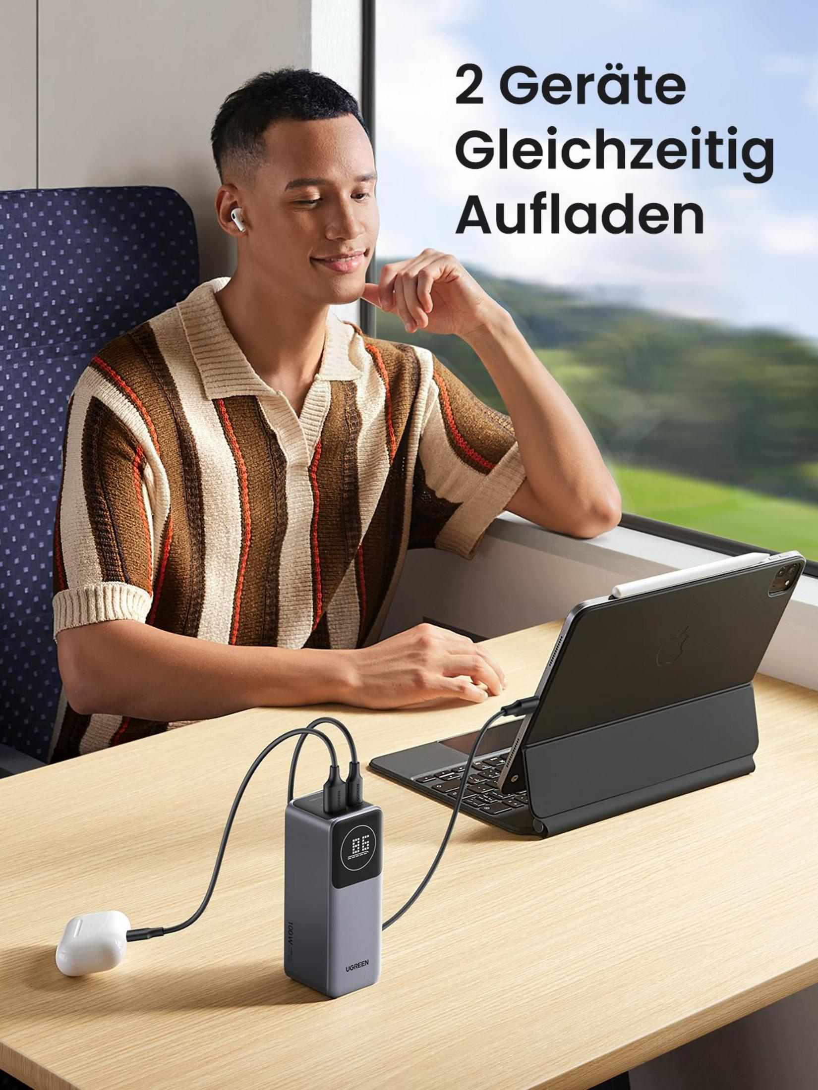 Mężczyzna i tablet ładują się. Tekst mówi: '2 Geräte Gleichzeitig Aufladen'.