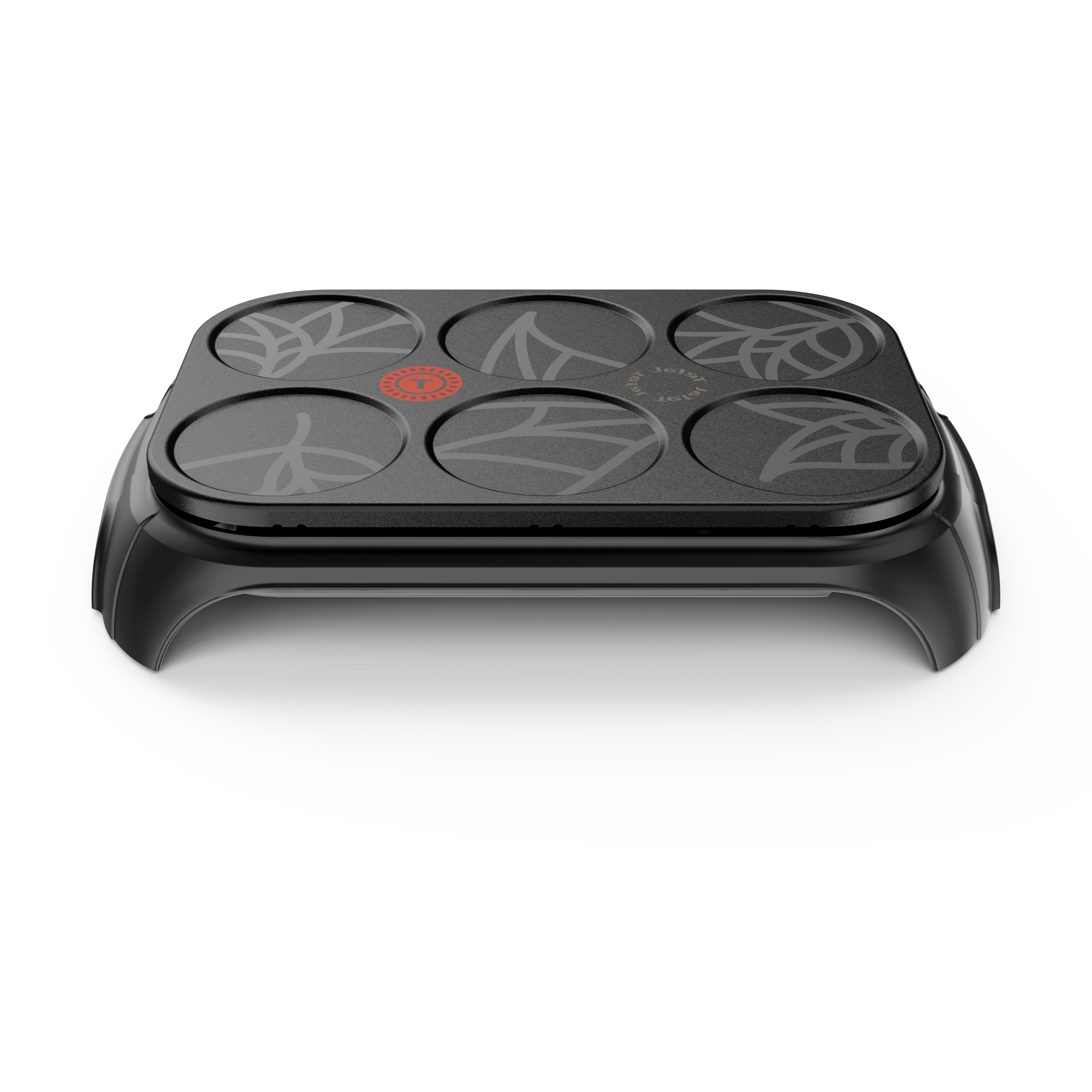 Czarna naleśnikarka z sześcioma powierzchniami i wzorem liści, ujęcie z bliska.