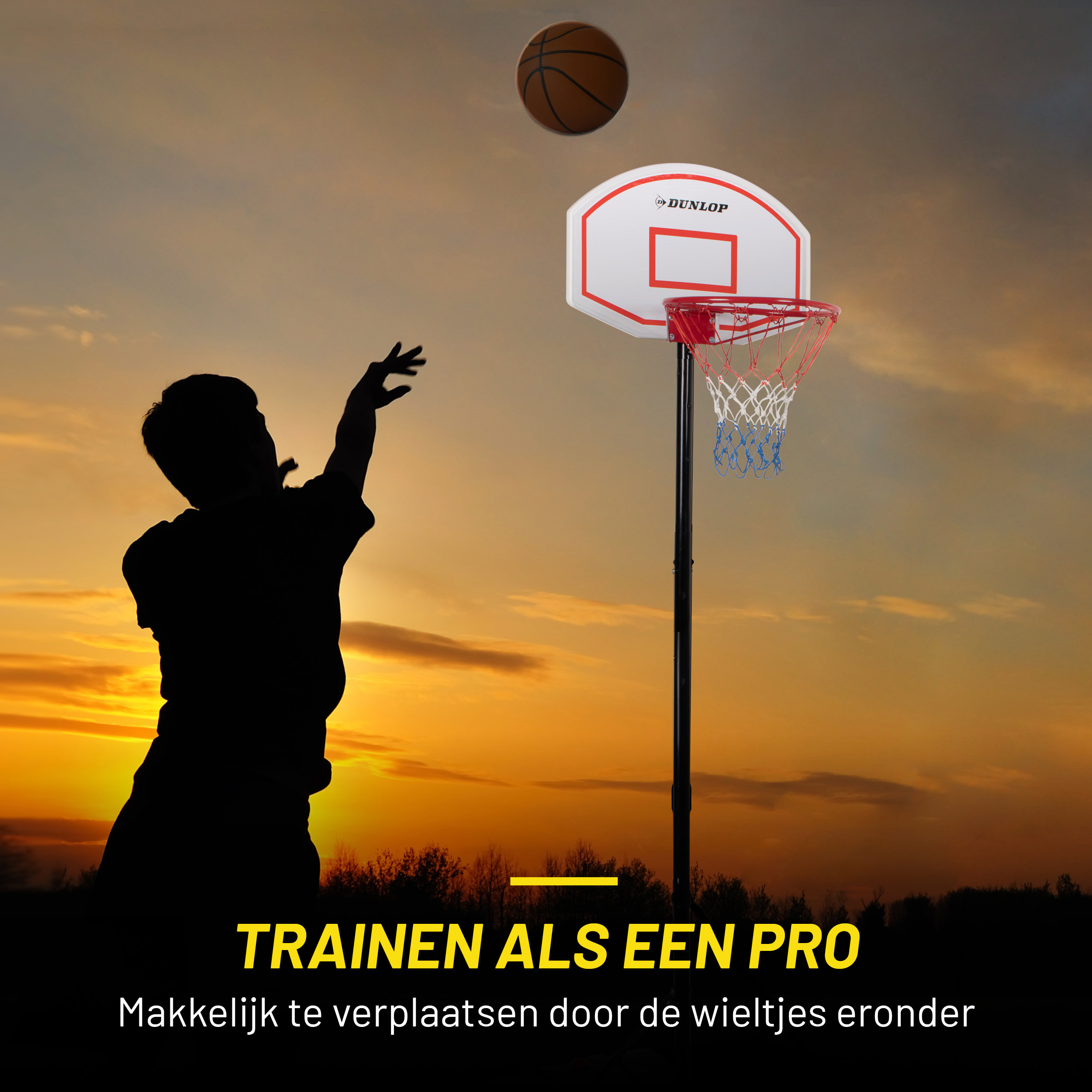 A person throwing a basketball at a hoop at sunset.