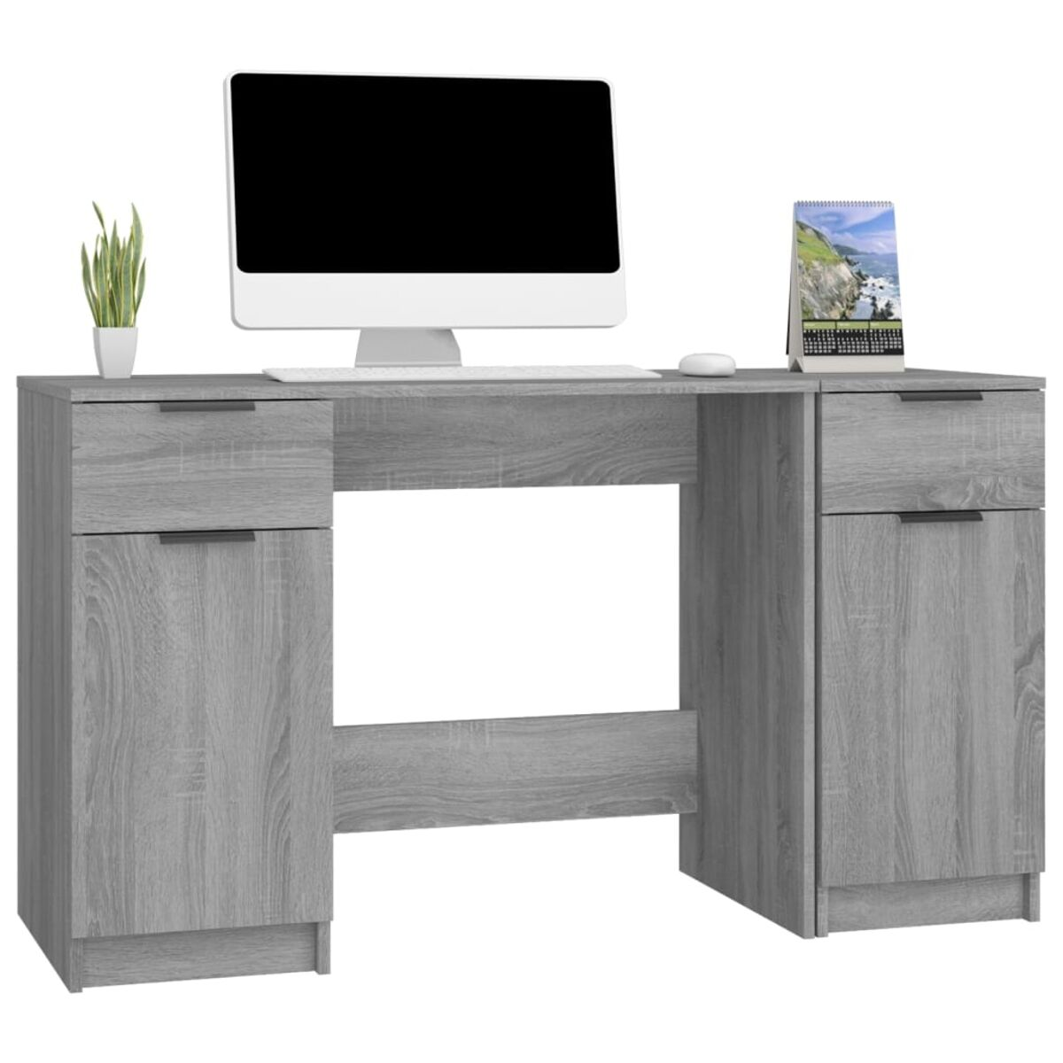 Schreibtisch mit Computer, Monitor, Zubehör und offenen Schubladen.