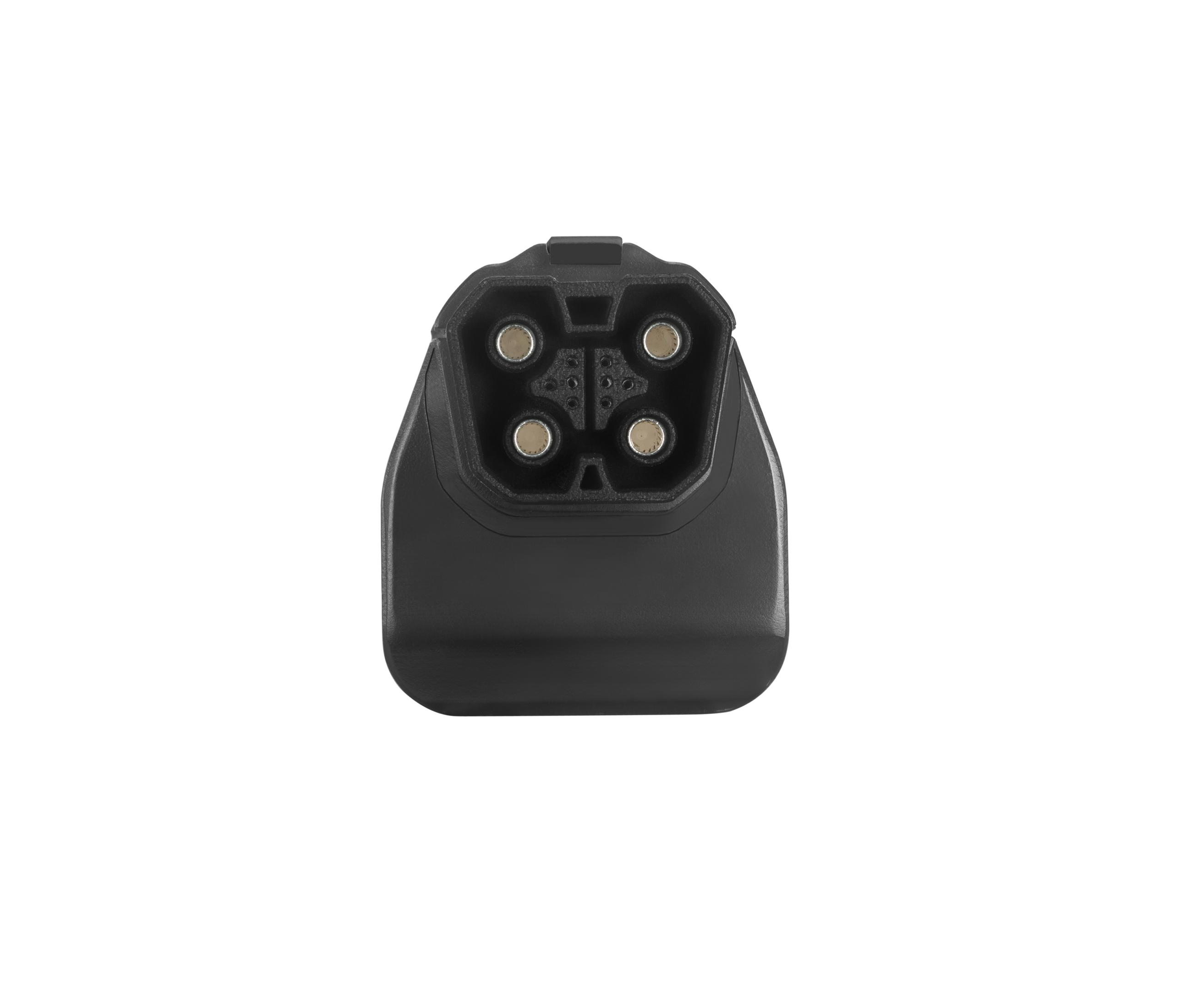 Conector de carga EV negro con cuatro pines, visto desde arriba.