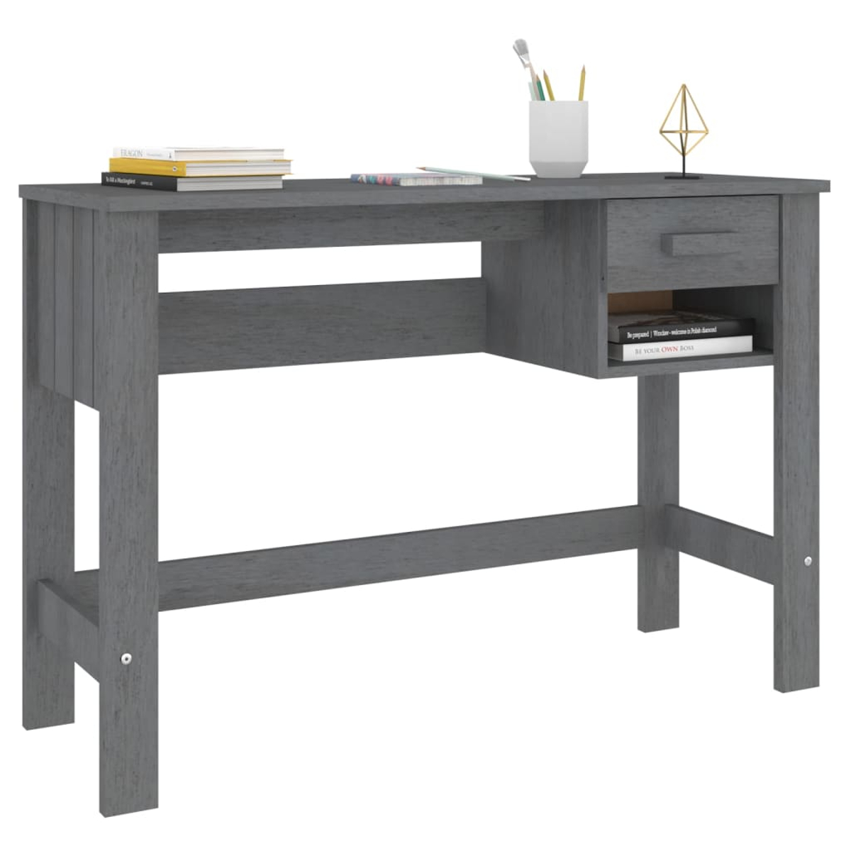 Ein grauer Holzschreibtisch mit Büchern, Stiften und einer kleinen weißen Tasse, mit Schublade und Regal.
