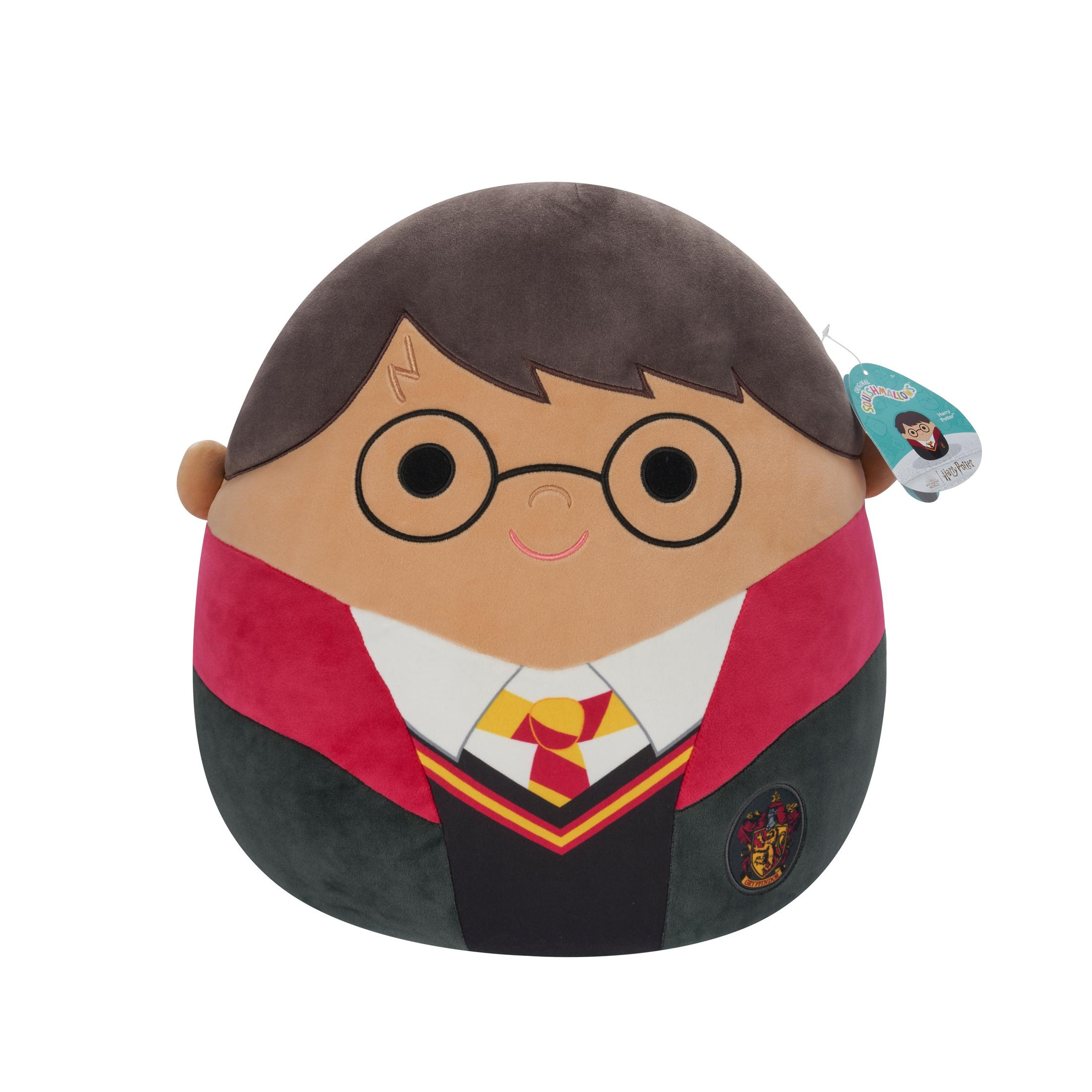 Ein Plüschtier von Harry Potter. Er hat runde Brille, Gryffindor-Schal und fröhlichen Ausdruck.