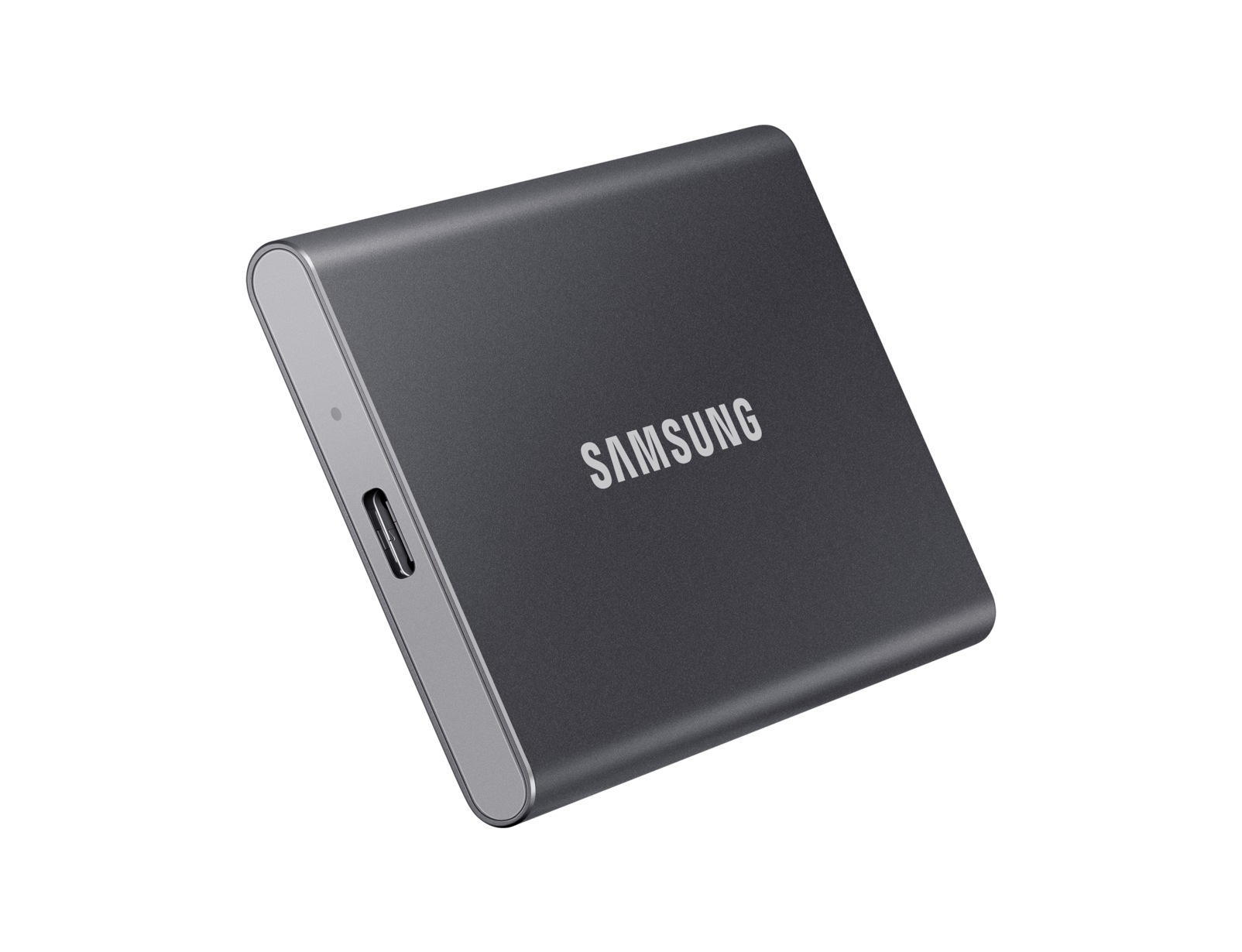 Disco rigido esterno Samsung grigio scuro su sfondo bianco. Logo Samsung visibile. Porta USB sul lato.