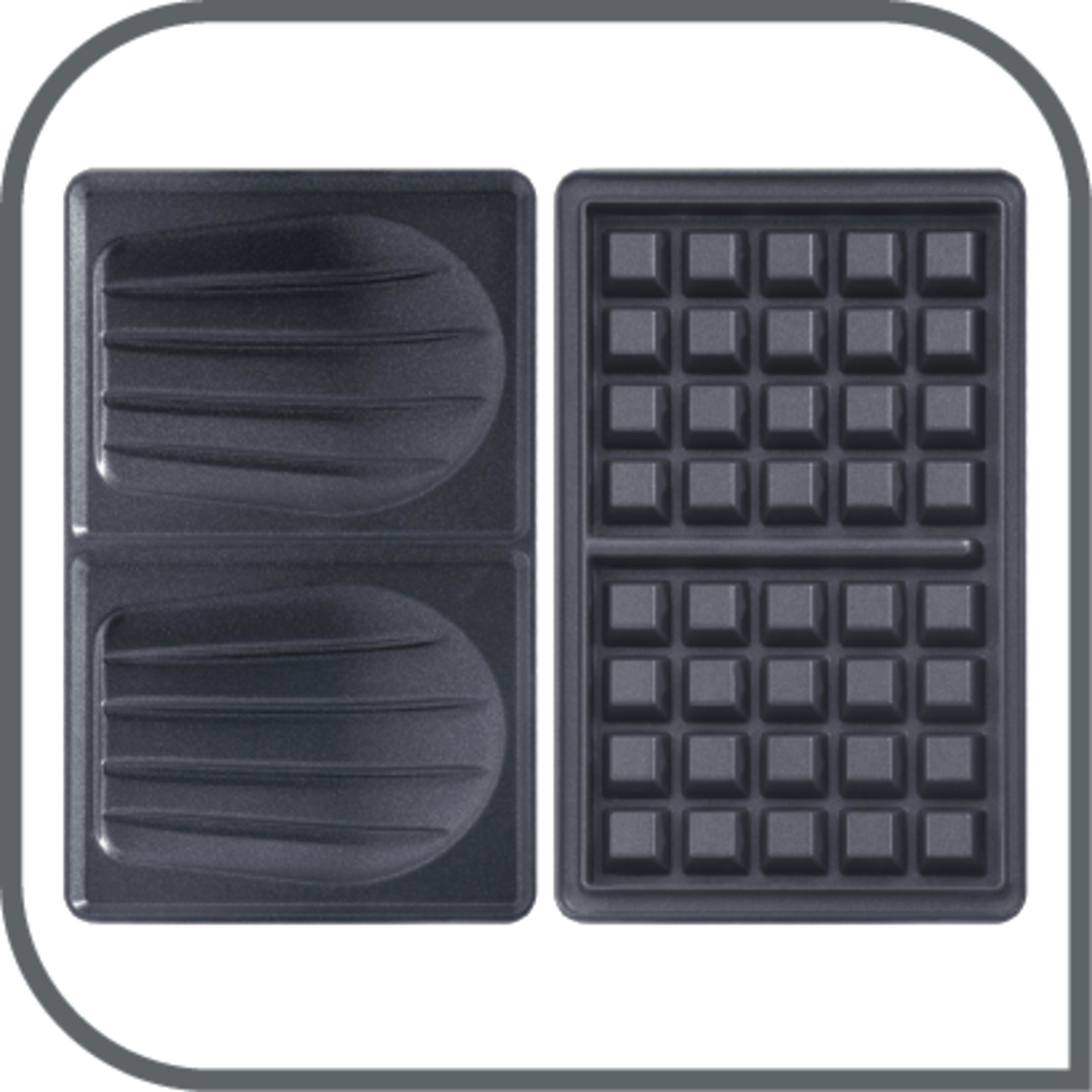 Open waffle iron, showing waffle grid pattern. Dark gray interior.