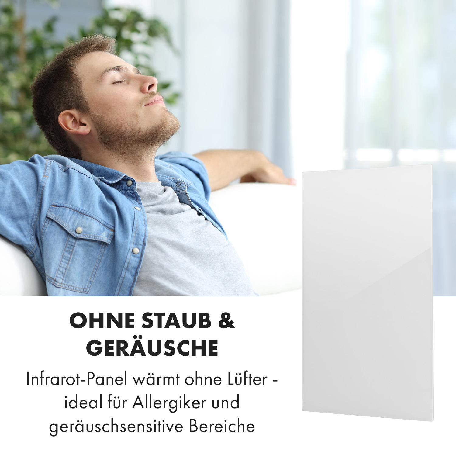Mann sitzt auf weißem Sofa, mit Heizung. Wandheizung rechts.
