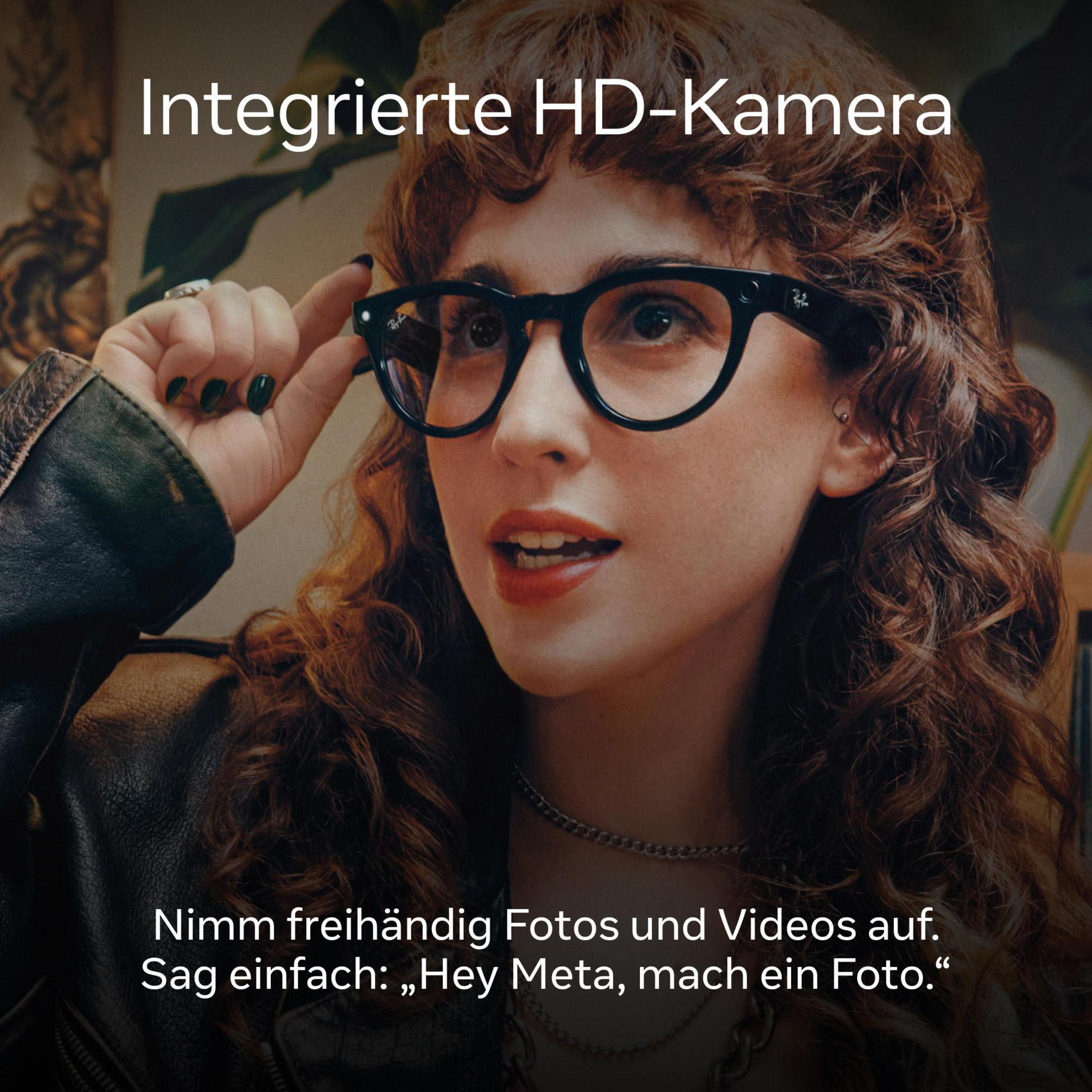 Eine Frau mit Brille macht ein Foto. Text: Nimm Fotos und Videos freihändig auf.