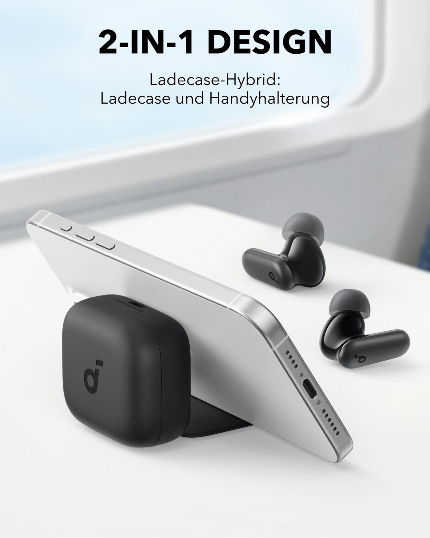 Un teléfono en una funda negra sobre una base de carga negra con auriculares.
