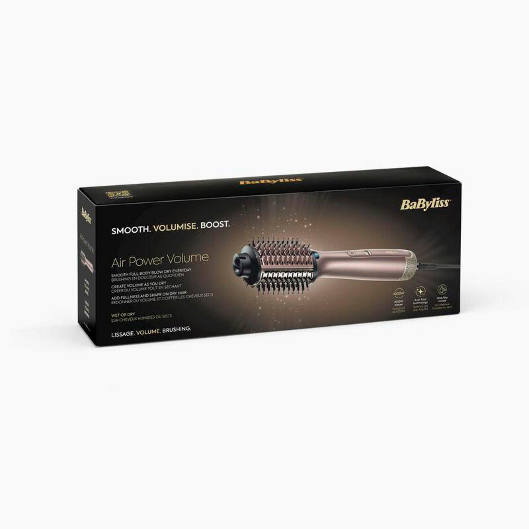 Ein Haarstyling-Werkzeug in einer schwarzen Box mit dem Markennamen 'BaByliss'. Das Produkt ist roségoldfarben.