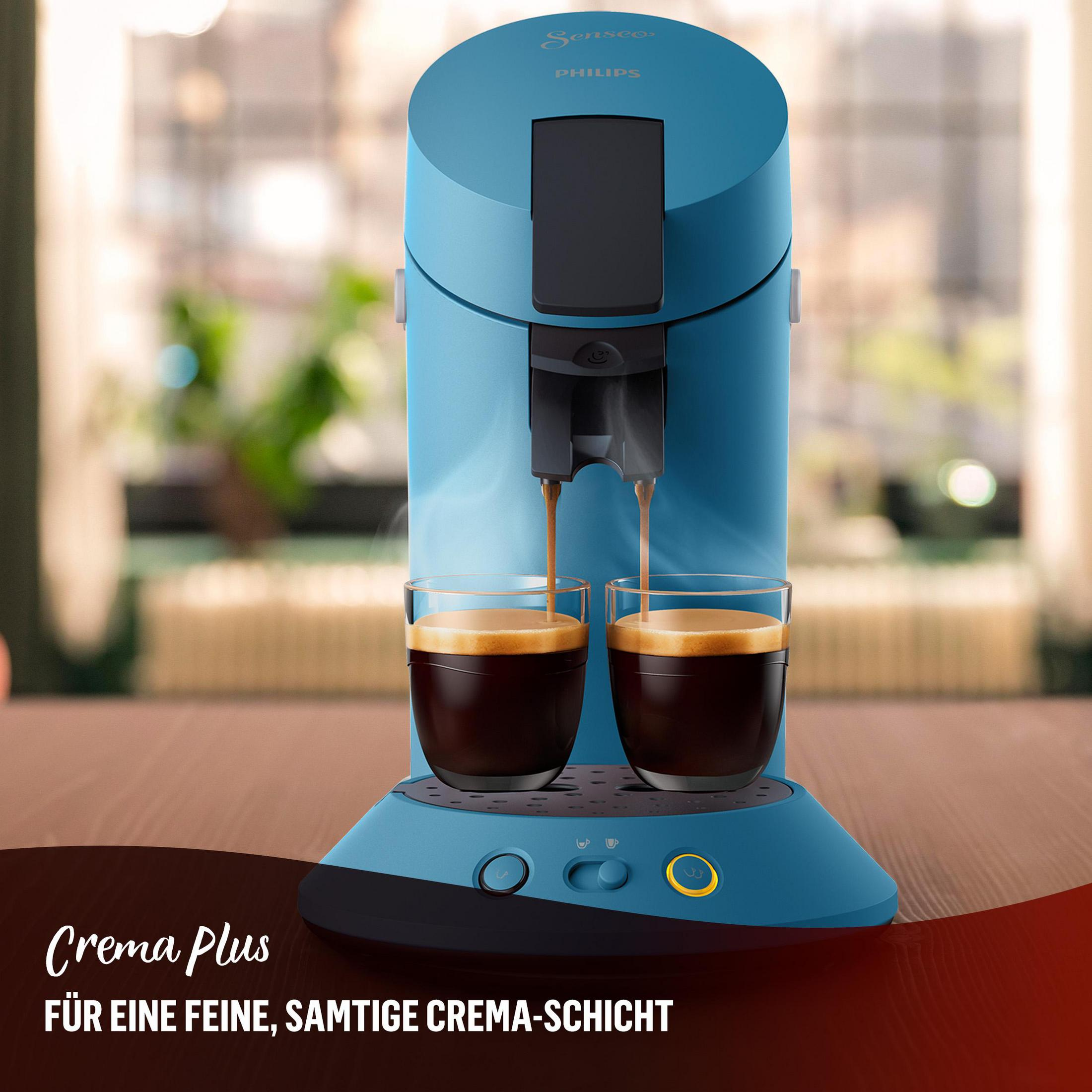 Blauer Kaffeeautomat mit zwei Gläsern, die mit Kaffee gefüllt werden. Text: Crema Plus.