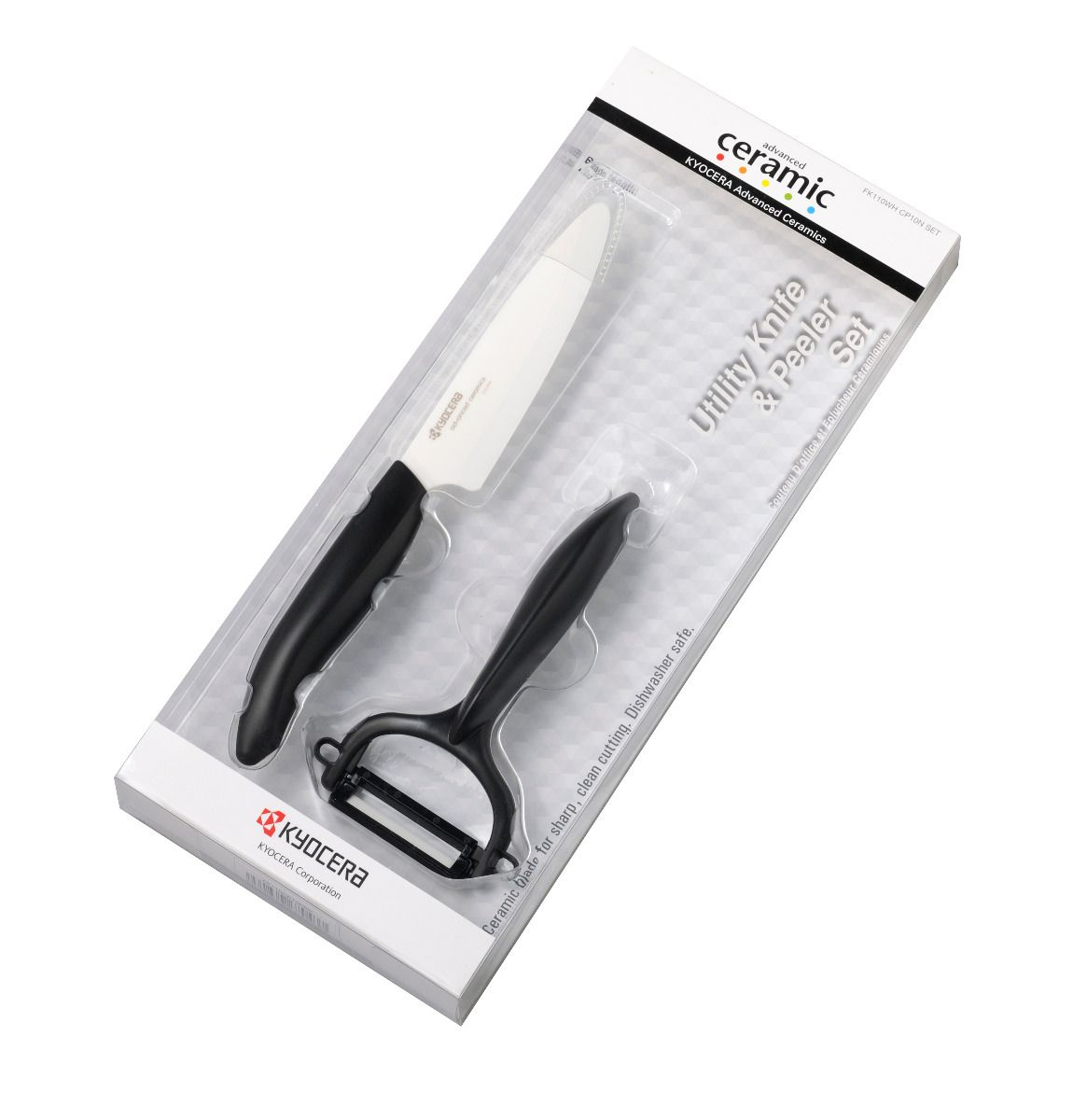 Weißes und schwarzes Keramikmesser- und Schäler-Set in einer transparenten Kunststoffverpackung auf weißem Hintergrund.