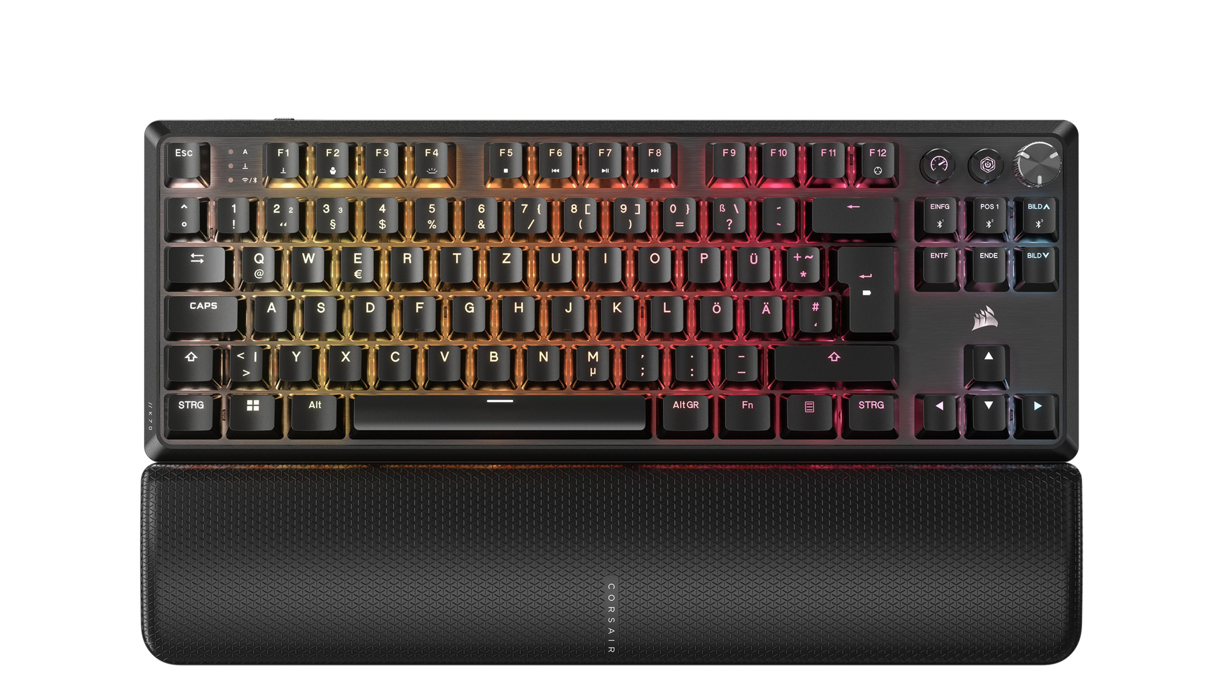 Czarna klawiatura bezprzewodowa z kolorowymi klawiszami i czarną podpórką pod nadgarstek.