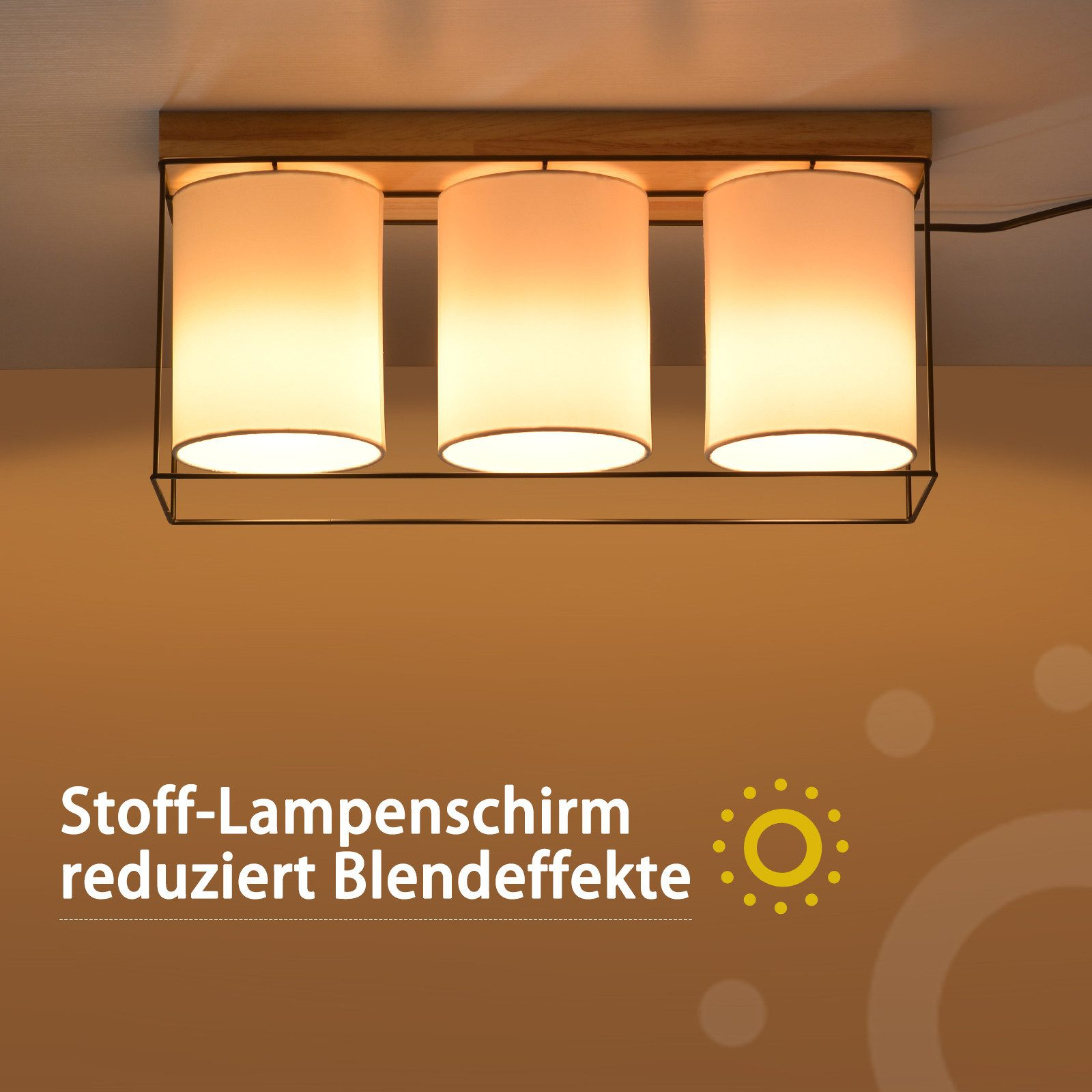 Lampada da soffitto con tre paralumi cilindrici. Testo: Stoff-Lampenschirm reduziert Blendeffekte.