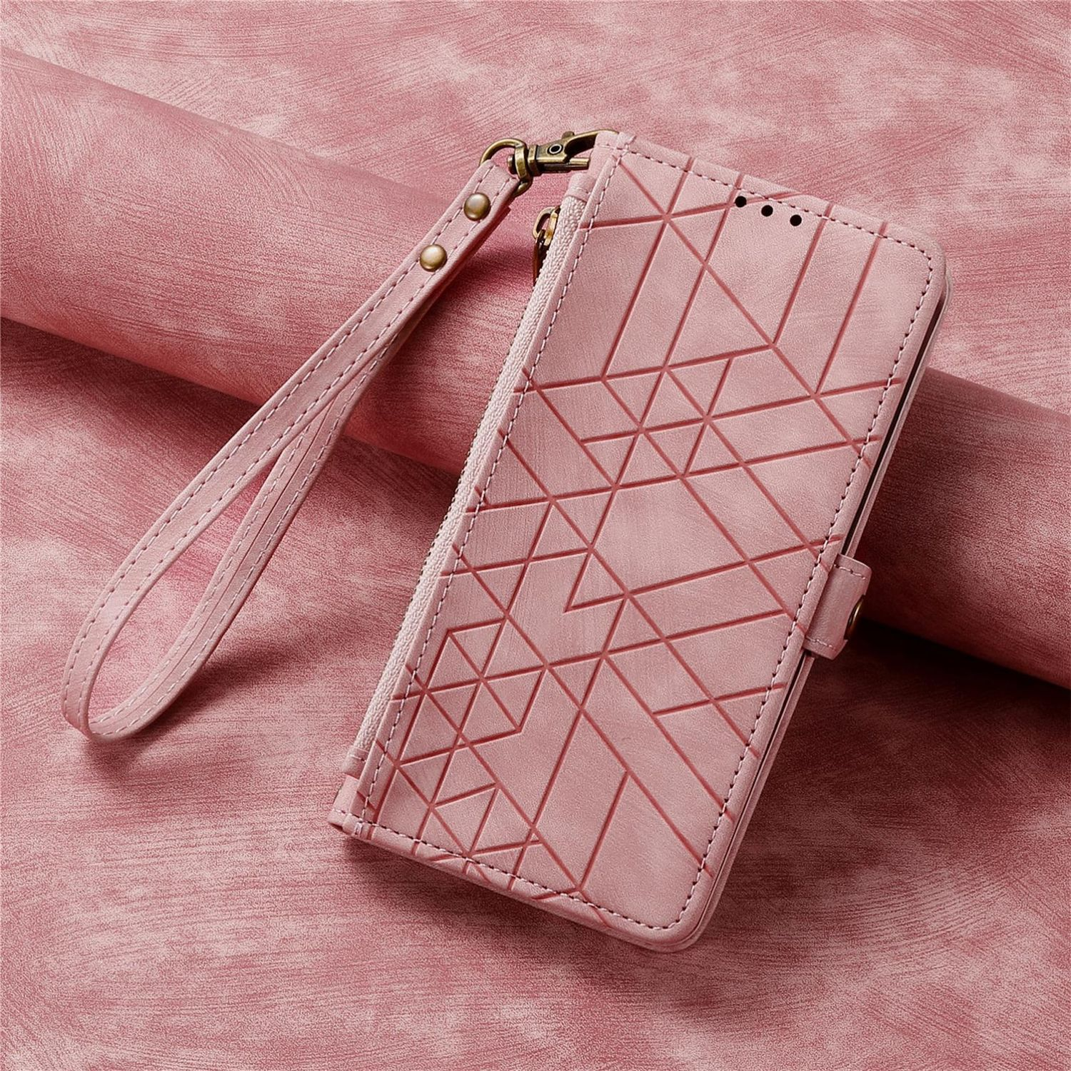 Rosa Handyhülle mit geometrischem Muster, offen, mit Handschlaufe auf rosa Oberfläche.