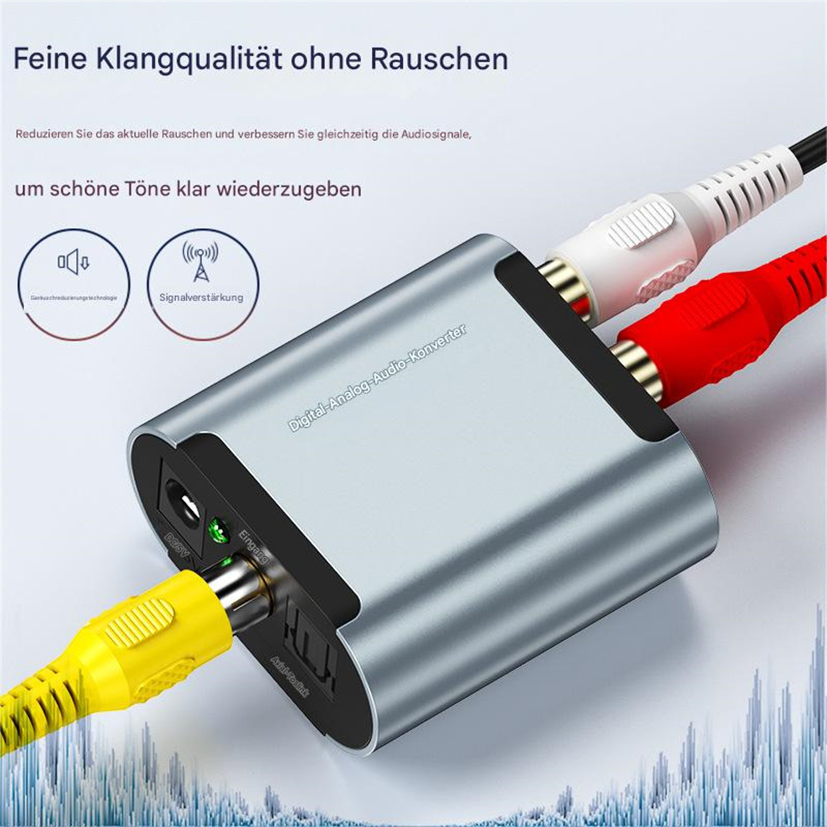 Silber-schwarzer Audio-Konverter mit roten und weißen Cinch-Kabeln. Ein gelbes Kabel ist ebenfalls angeschlossen.