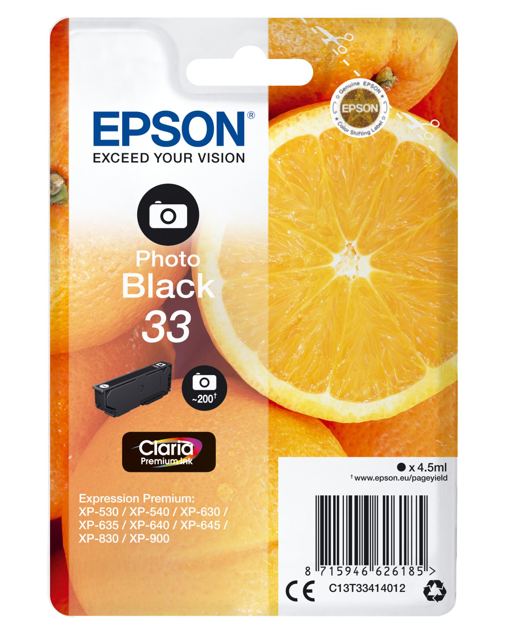 Verpakking van Epson printerinktpatroon. Zwarte inkt, sinaasappels op de achtergrond.