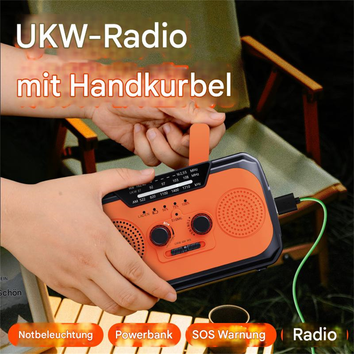 Orange tragbares Radio mit Handkurbel, beschriftet UKW-Radio und verschiedenen Funktionsbeschriftungen.