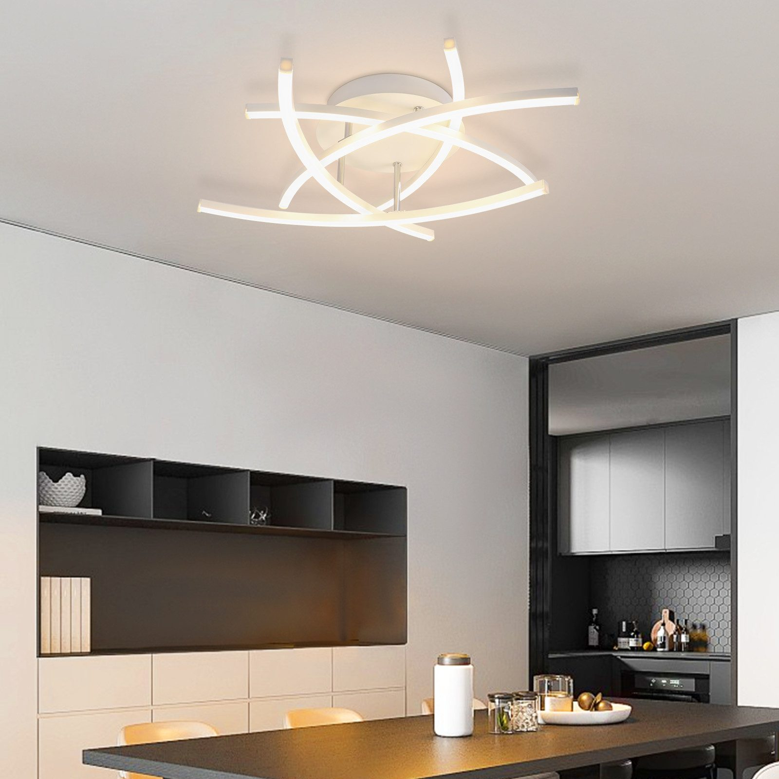 Una lampada da soffitto bianca dal design unico, illumina una cucina moderna.